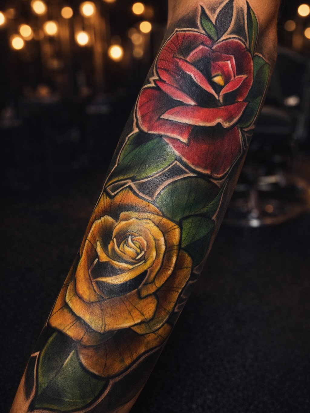 Roses American traditional tattoo on the forearm by Angel Jmz