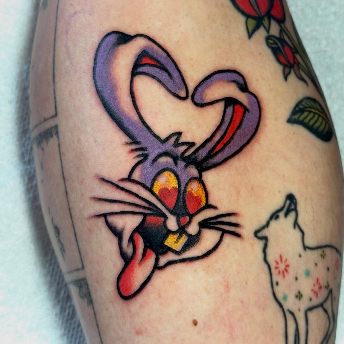 Looney tunes character American traditional tattoo on the forearm by Ty Elias