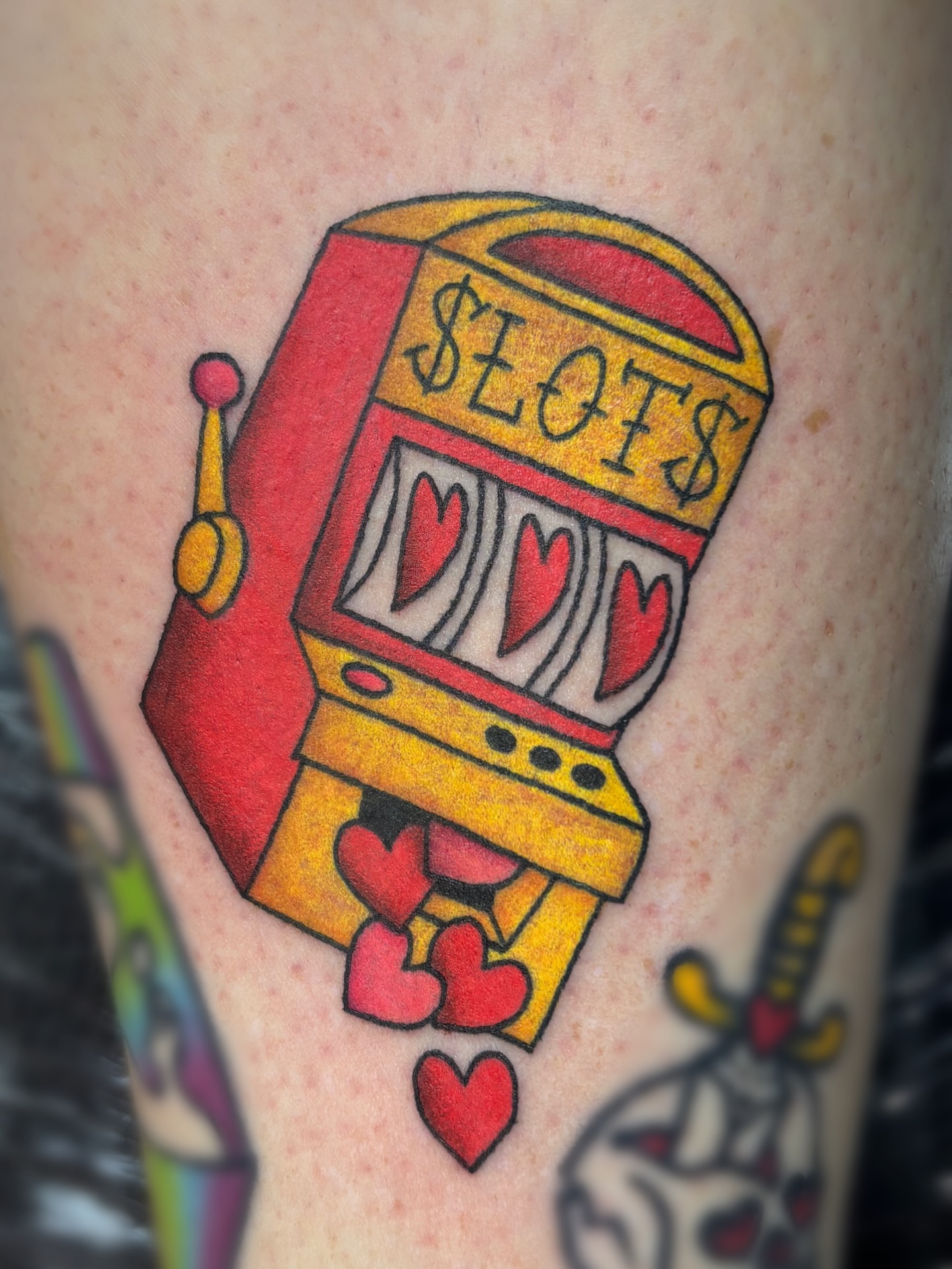 Slot machine American traditional tattoo on the forearm by Bree Burgess