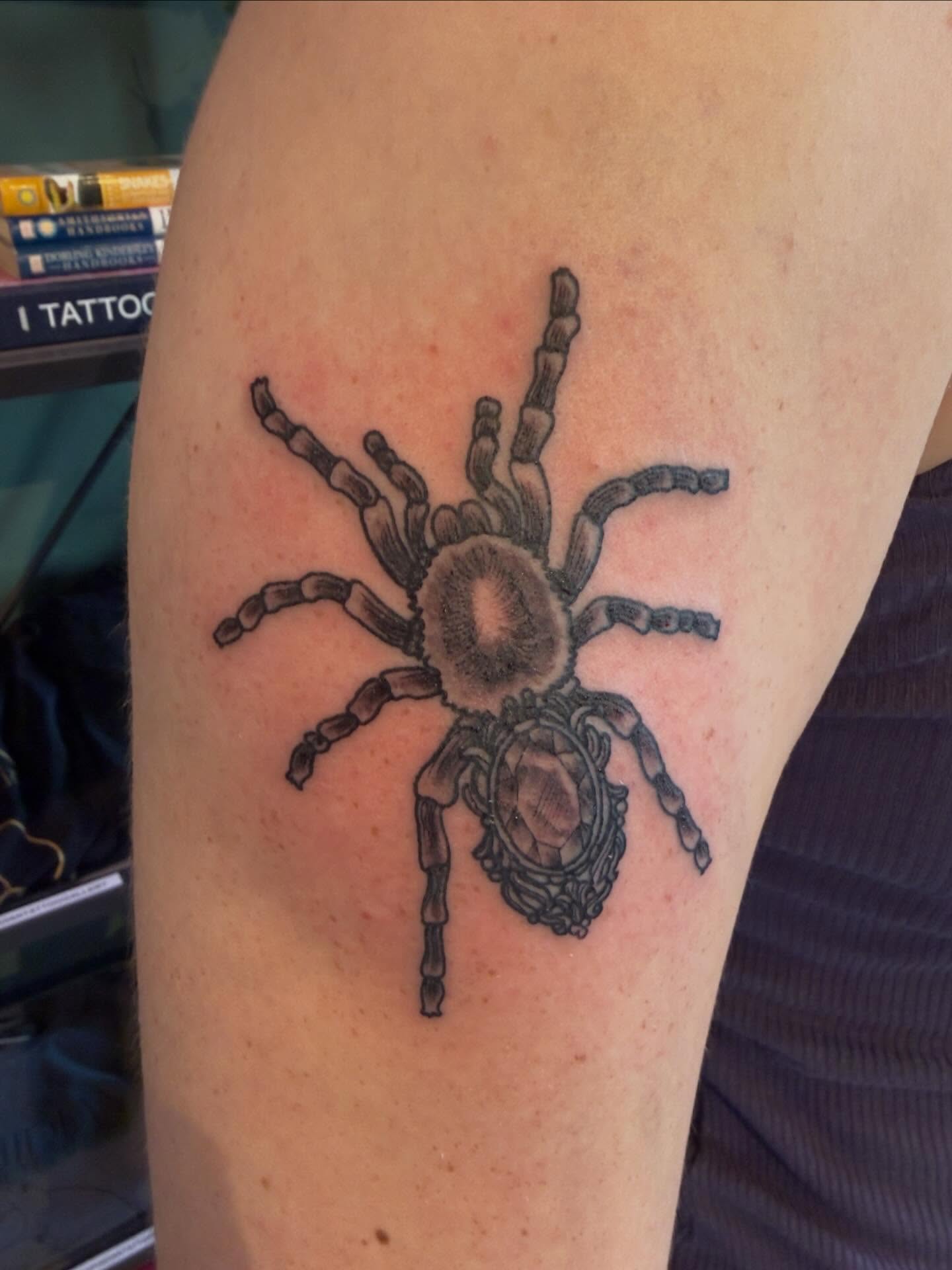 Tarantula black and grey tattoo on the forearm by Patrick Carroll