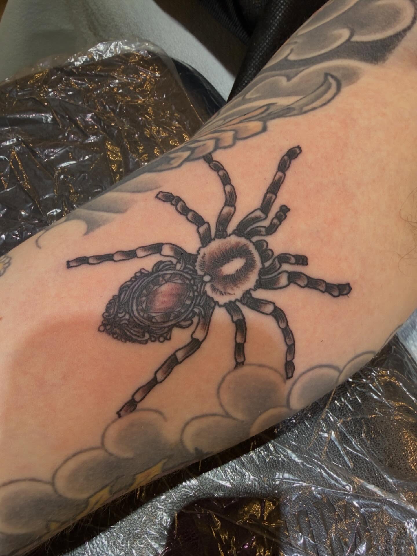 Spider black and grey tattoo on the forearm by Patrick Carroll