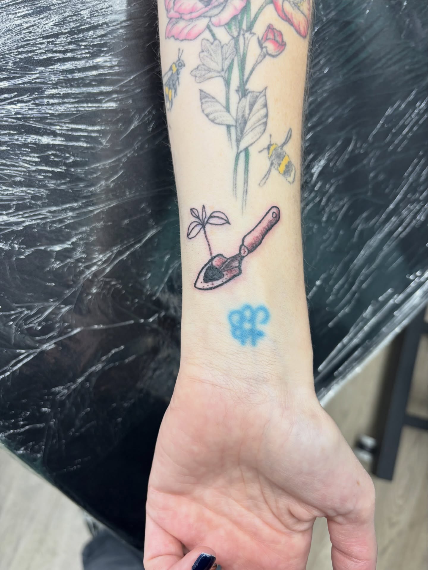 Shovel and plant new school tattoo on the forearm by Calen Copeland