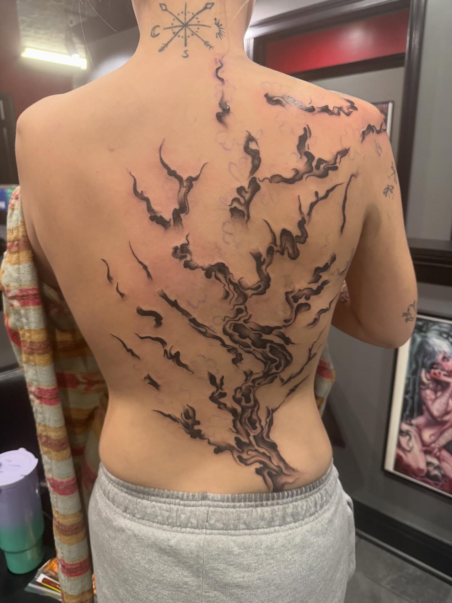 Tree branches black and grey tattoo on the back by Courtney