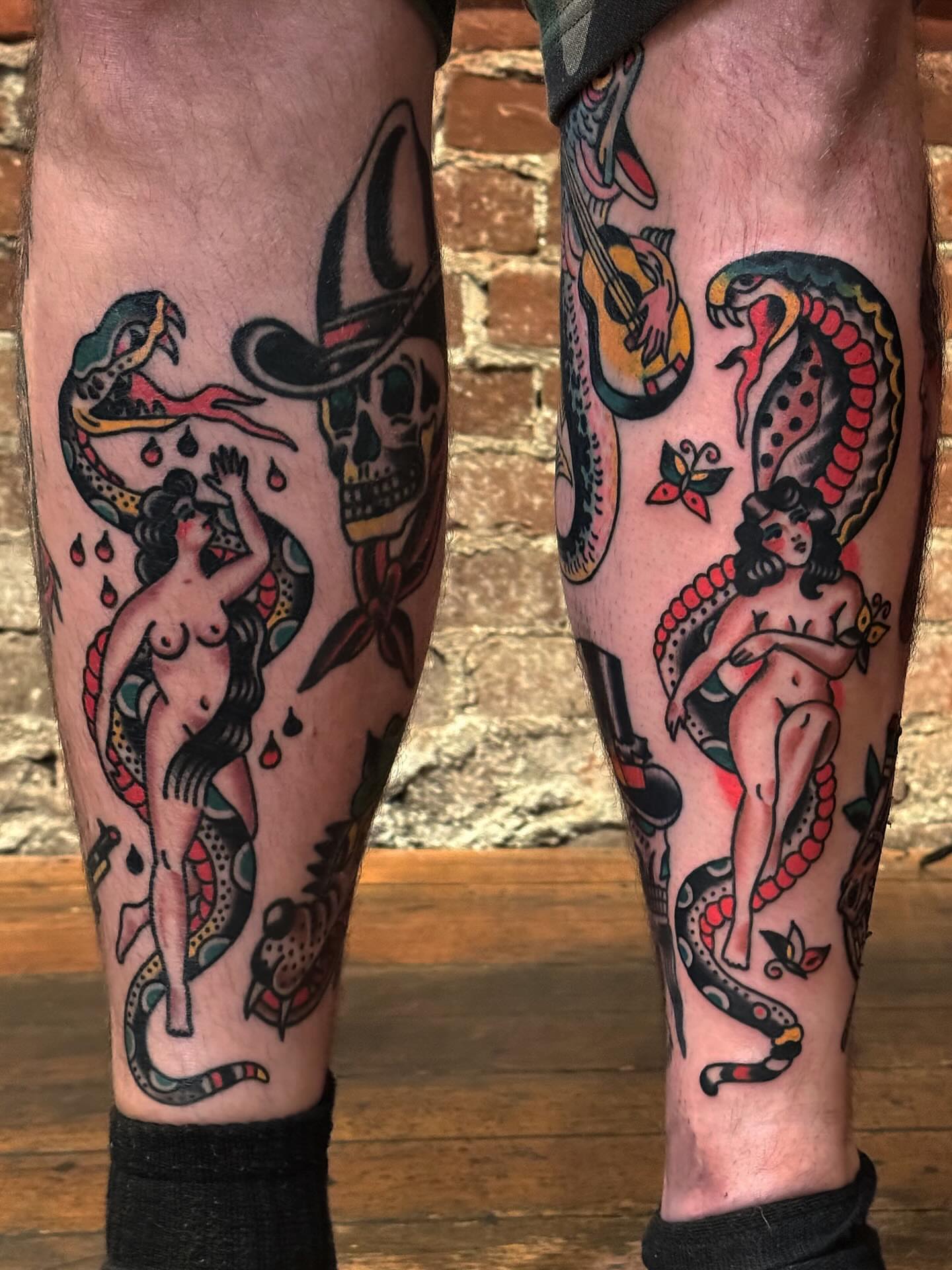 Mermaid and snake American traditional tattoo on the calf by Bryce Shearer