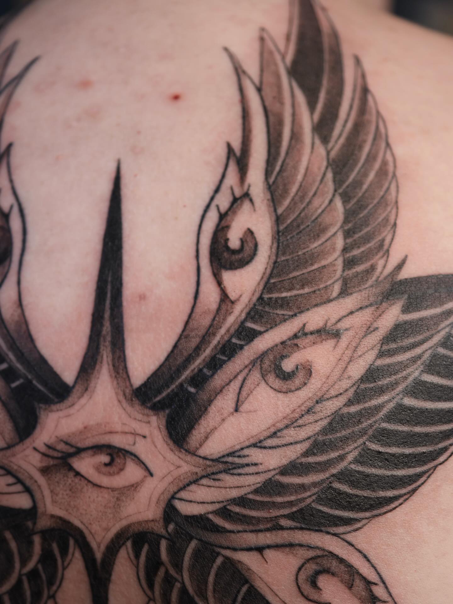 Winged dragon realism tattoo on the back by morgan purcey