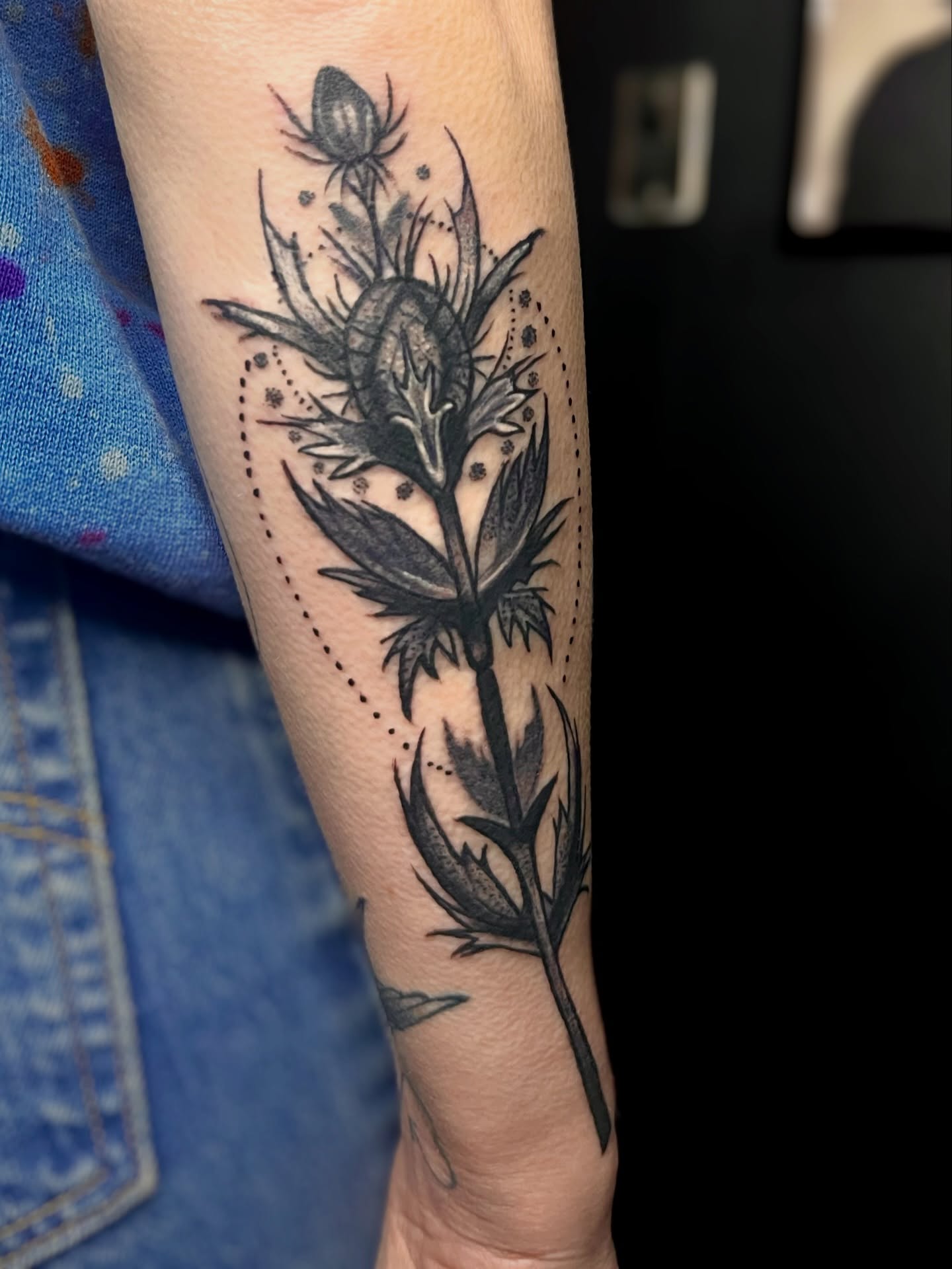 Thistle black and grey tattoo on the forearm by Misha Dumois, Seattle, Washington