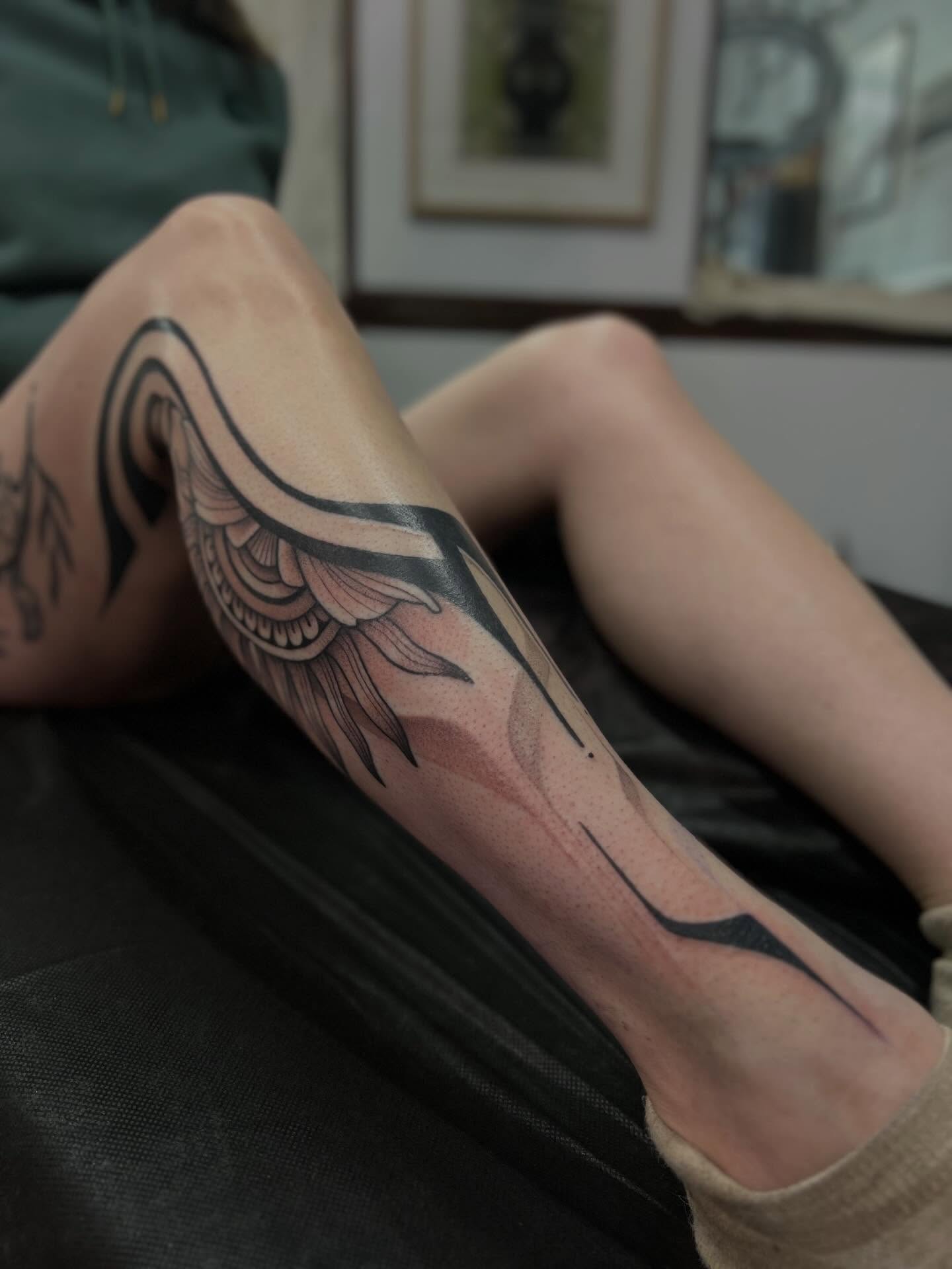 Wing black and grey tattoo on the forearm by Avrey Simone