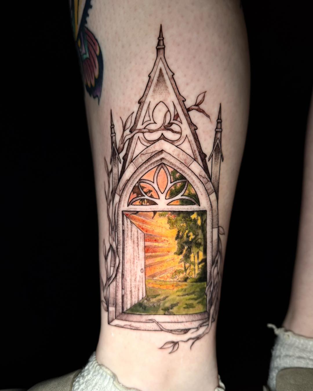 Gothic door illustrative tattoo on the forearm by Mikaela Rush, Greensboro, North Carolina