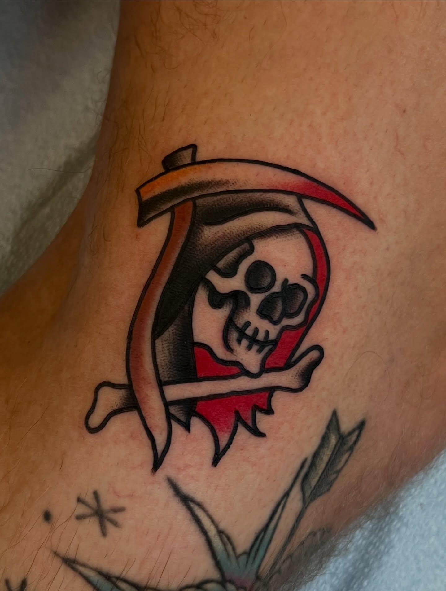Reaper skull American traditional tattoo on the forearm by Anthony Tattooer, Seattle, Washington