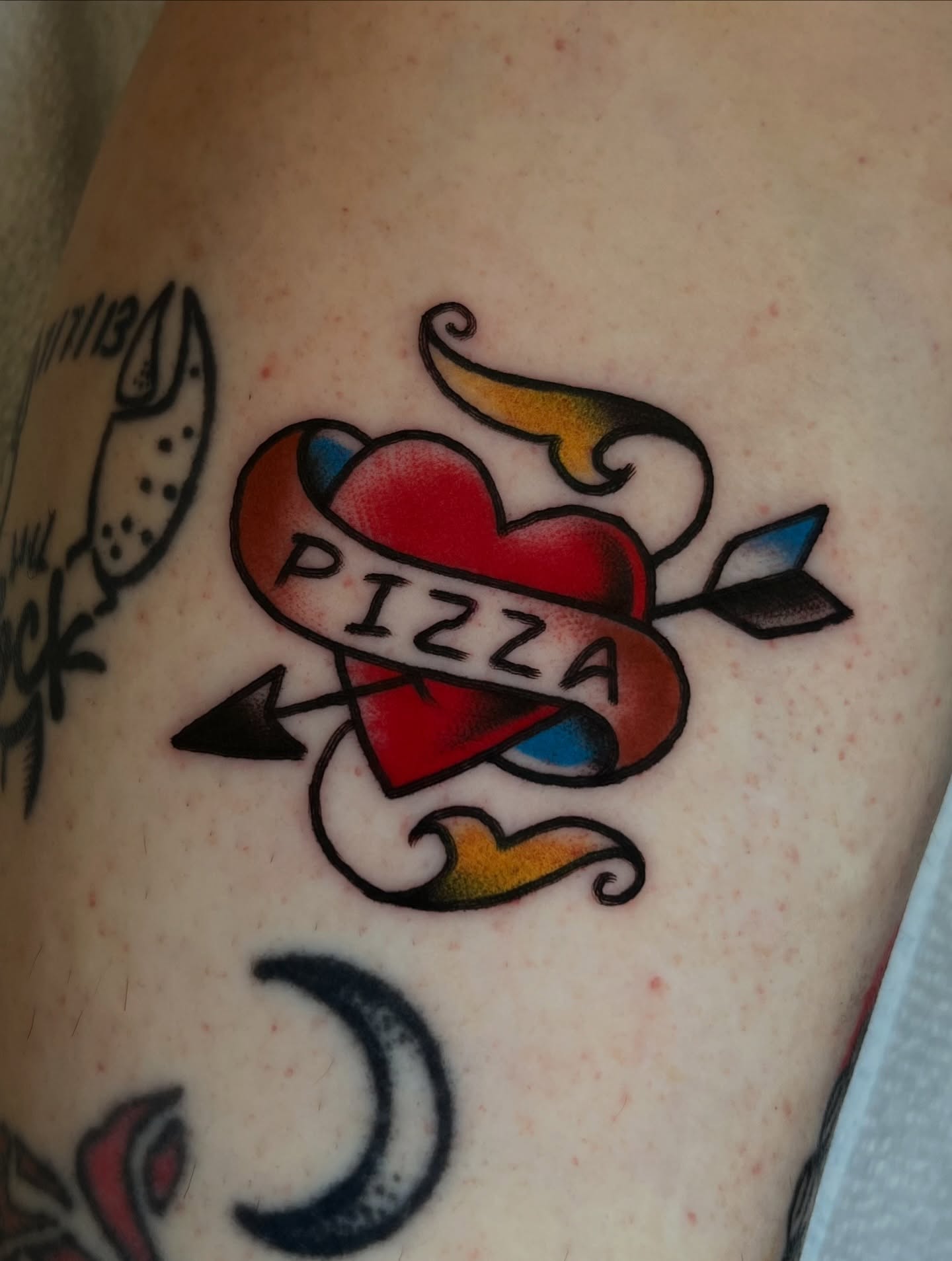 Pizza heart American traditional tattoo on the forearm by Anthony Tattooer, Seattle, Washington