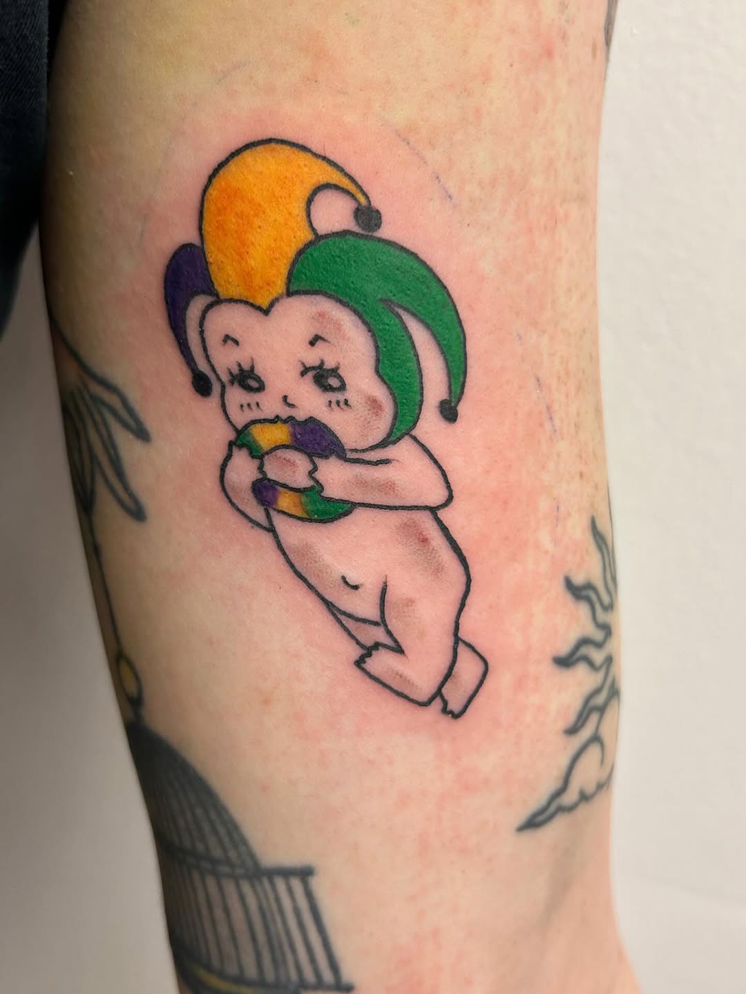 New school tattoo on the forearm by Chris
