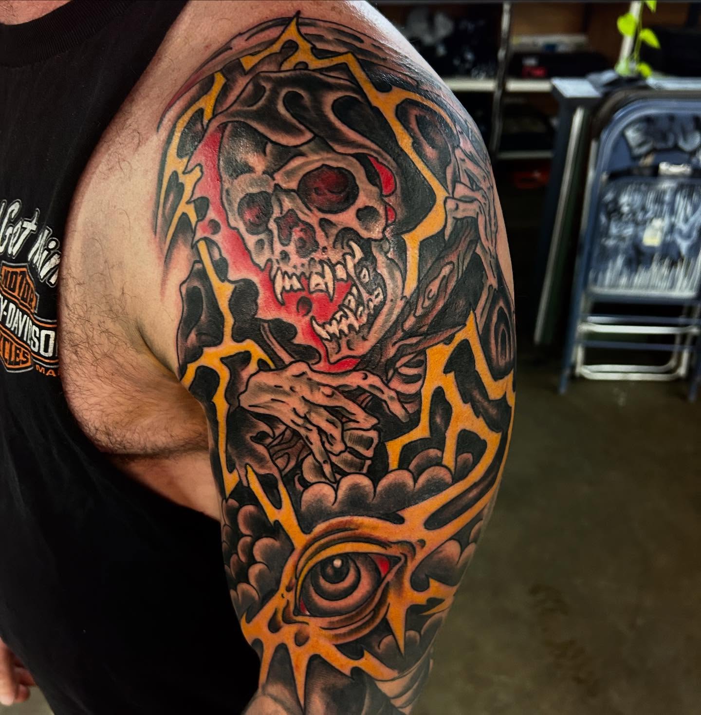 Skull and eye dark realism tattoo on the shoulder by Dylan O'Quin