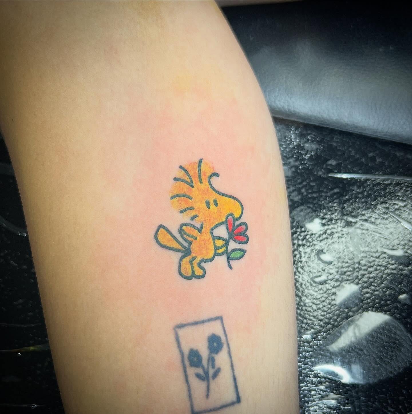 Calvin and hobbes new school tattoo on the thigh by Taylor Estrella
