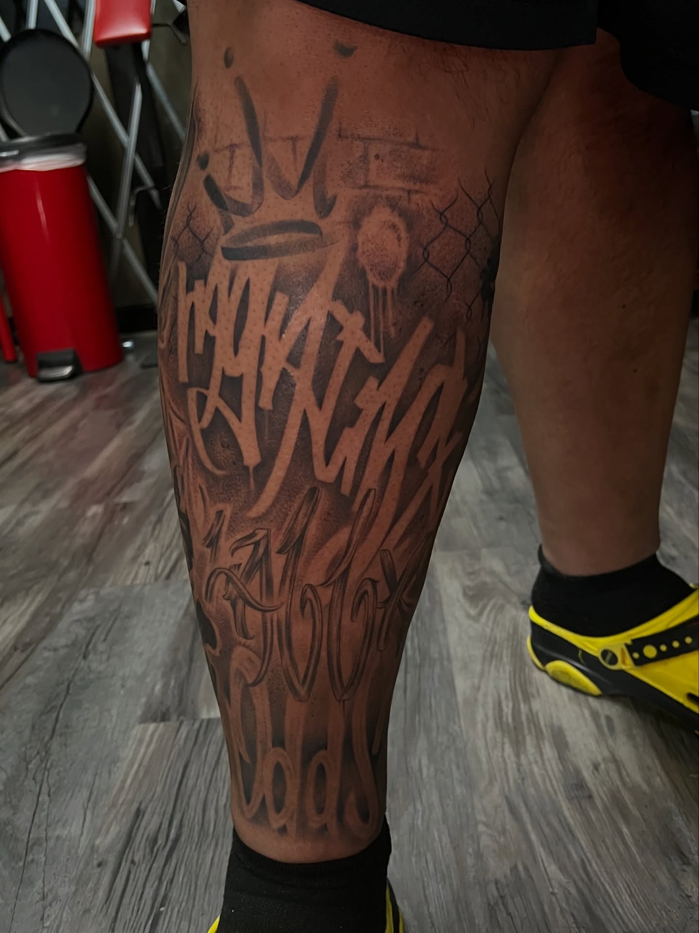 Script lettering lettering script tattoo on the calf by Jericho Las Vegas tattoo artist, Las Vegas, Nevada
