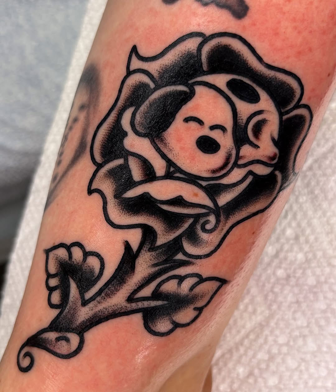 Dog face in rose new school tattoo on the forearm by ✨ Gabi ✨