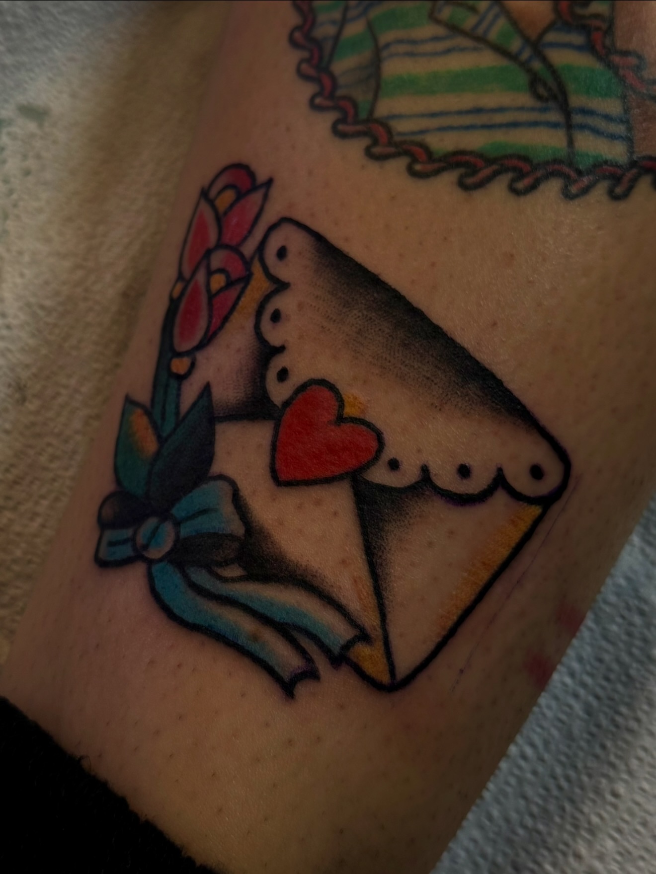 Ice cream cone American traditional tattoo on the forearm by Zac Clark