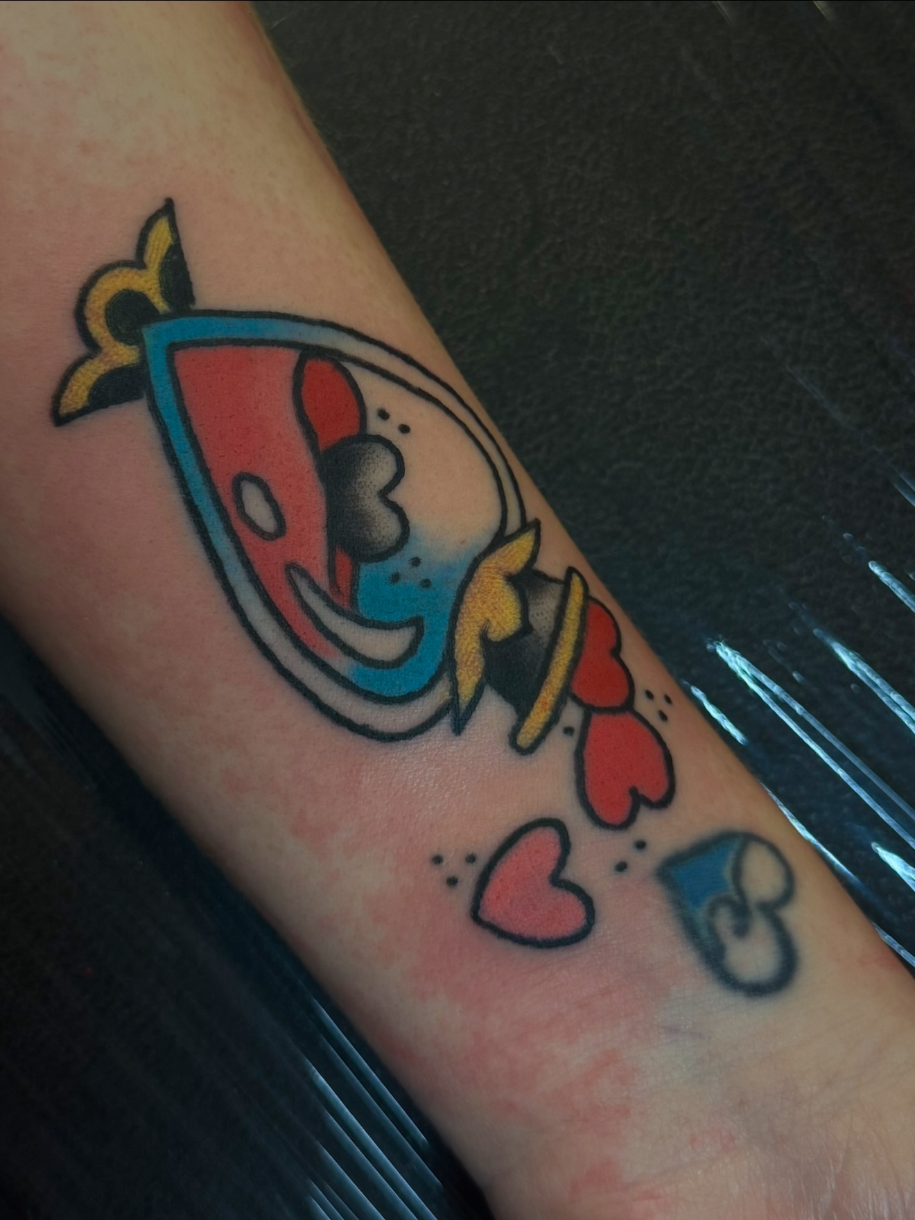 Fish American traditional tattoo on the forearm by Zac Clark