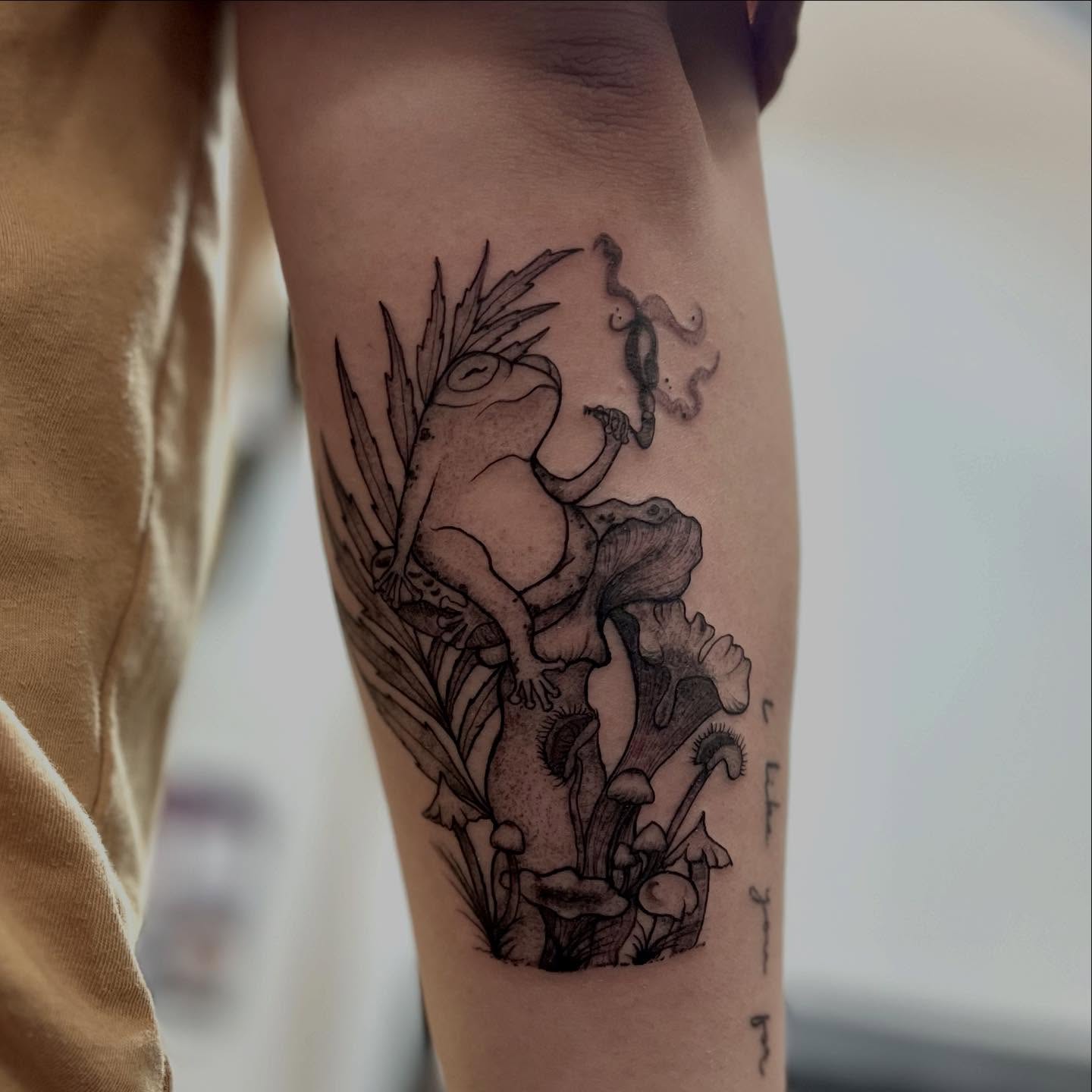 Frog and pitcher plant black and grey tattoo on the forearm by 𝖑𝖎𝖑 𝖗𝖎𝖘𝖘