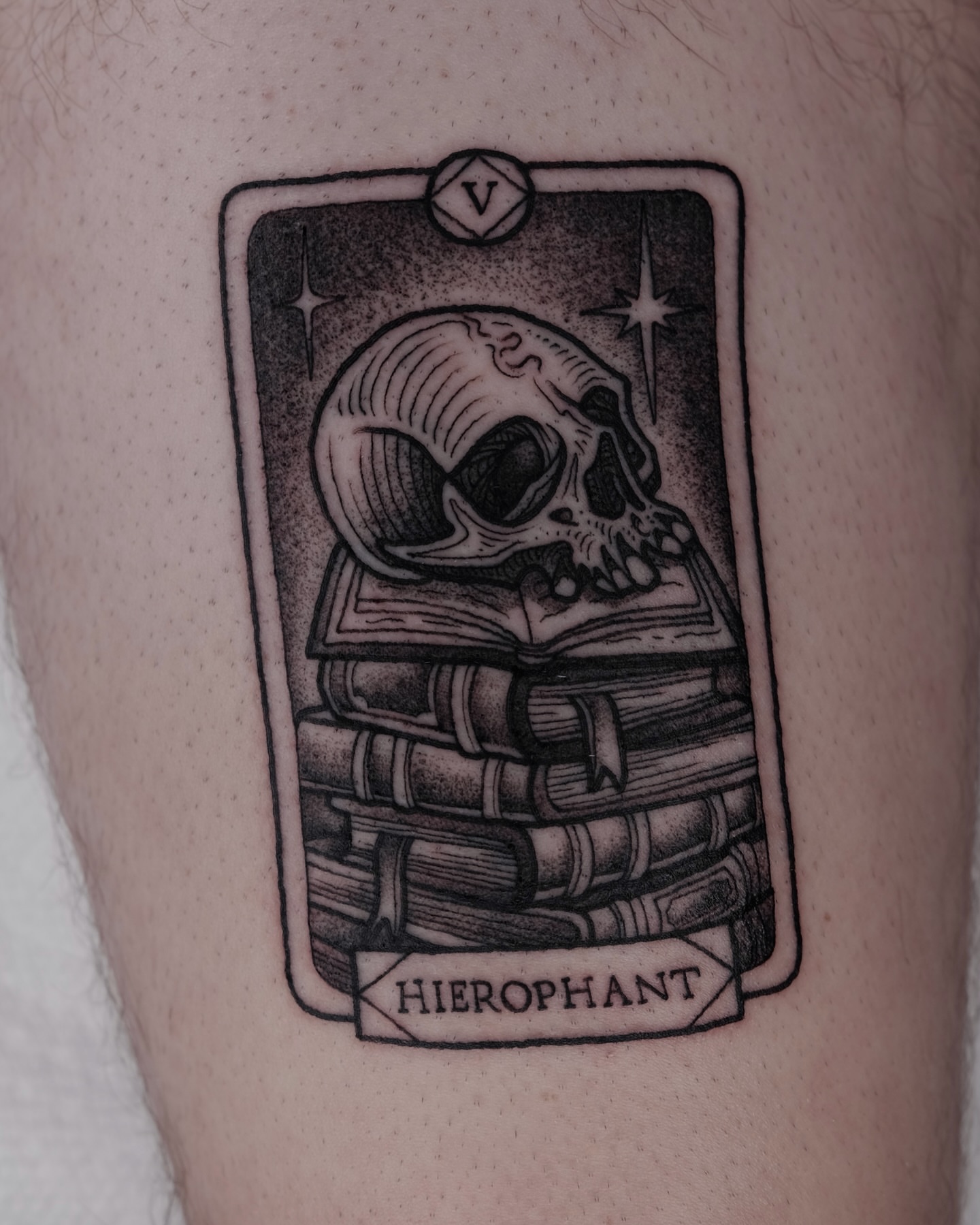 Hierophant card black and grey tattoo on the thigh by Kyle Patrick