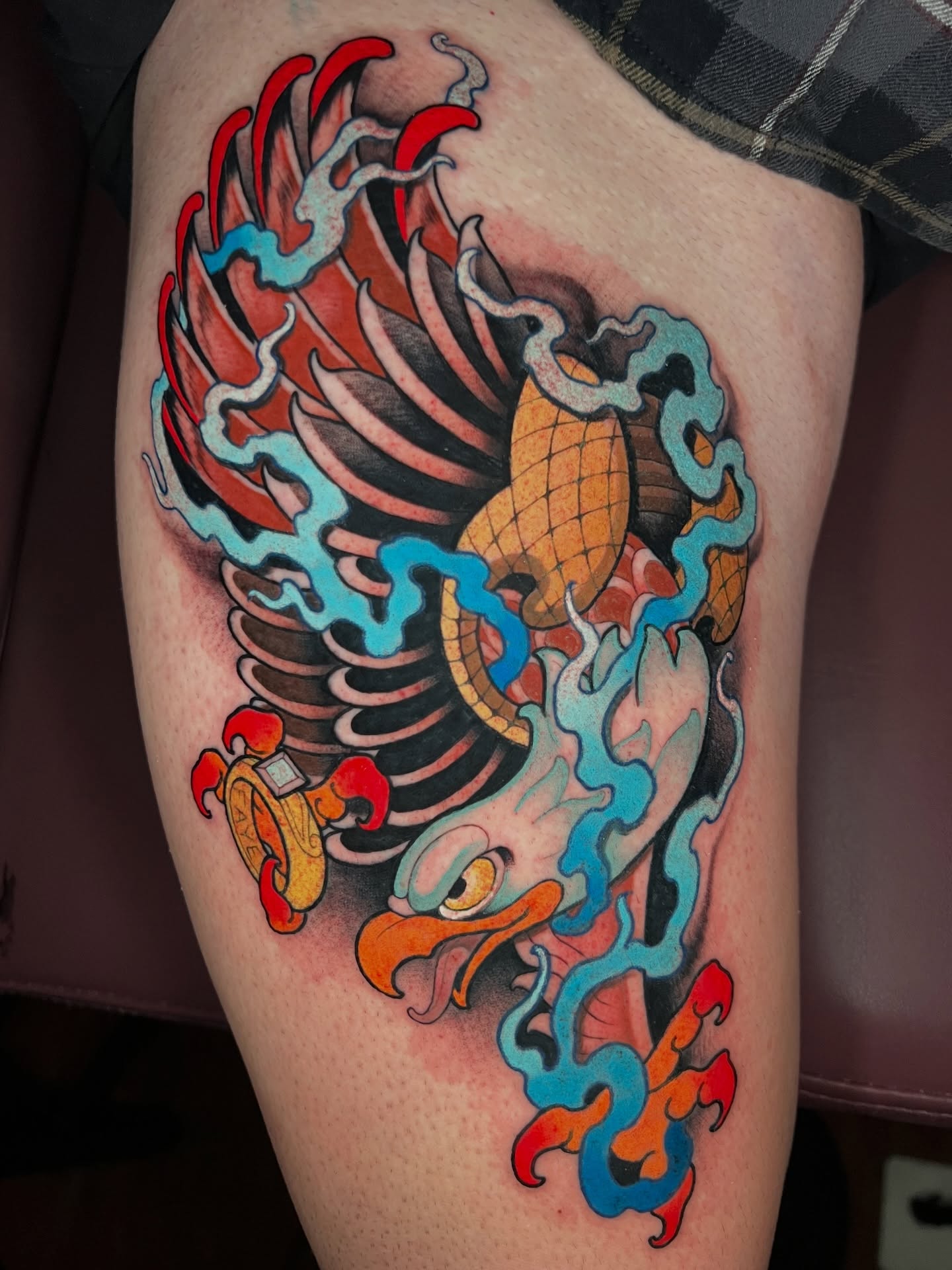 Phoenix American traditional tattoo on the thigh by Skyler Miller
