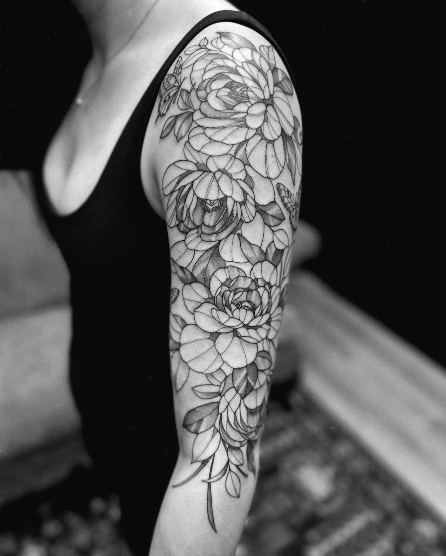 Floral bouquet black and grey tattoo on the forearm by 𝔍𝔞𝔯𝔢𝔡 𝔞𝔩𝔩𝔢𝔫