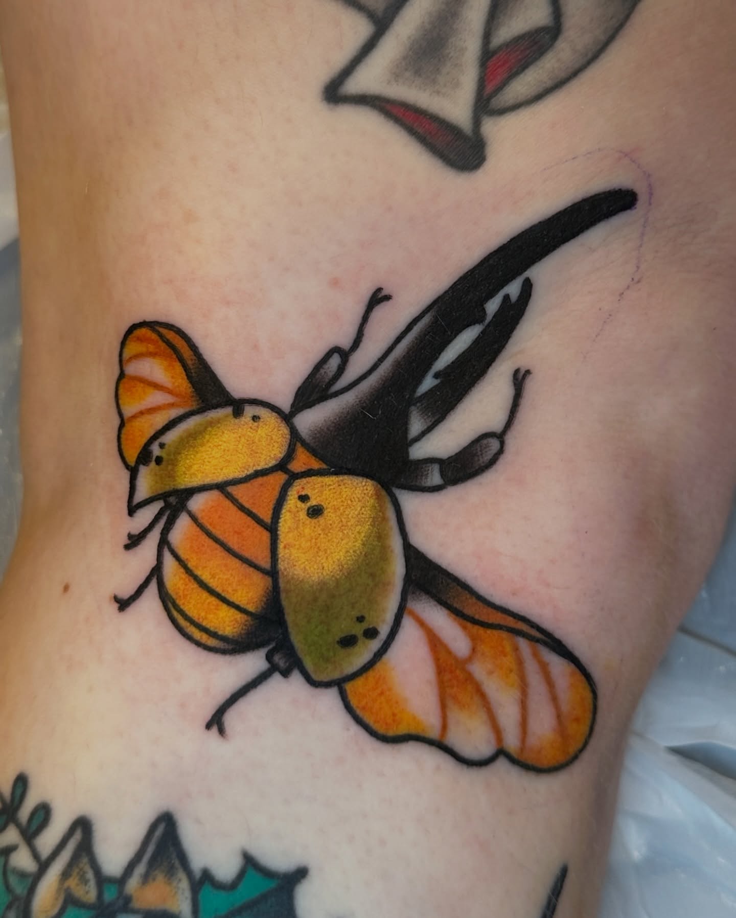Bee American traditional tattoo on the forearm by Paige Ochoa