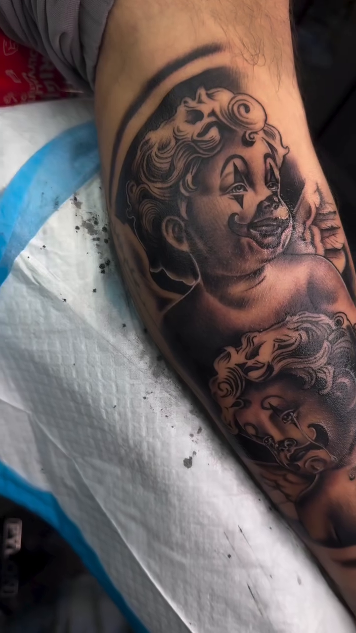 Two cherubs realism tattoo by Licensed Tattoo Artist πΈπ»