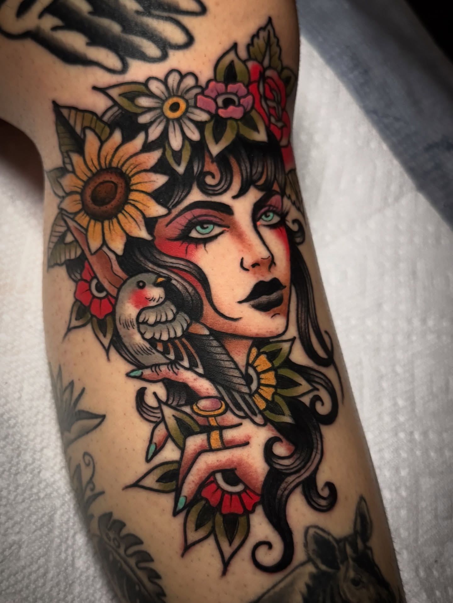 Woman with bird American traditional tattoo on the forearm by K y l e   M a c K e n z i e, Salem, Massachusetts