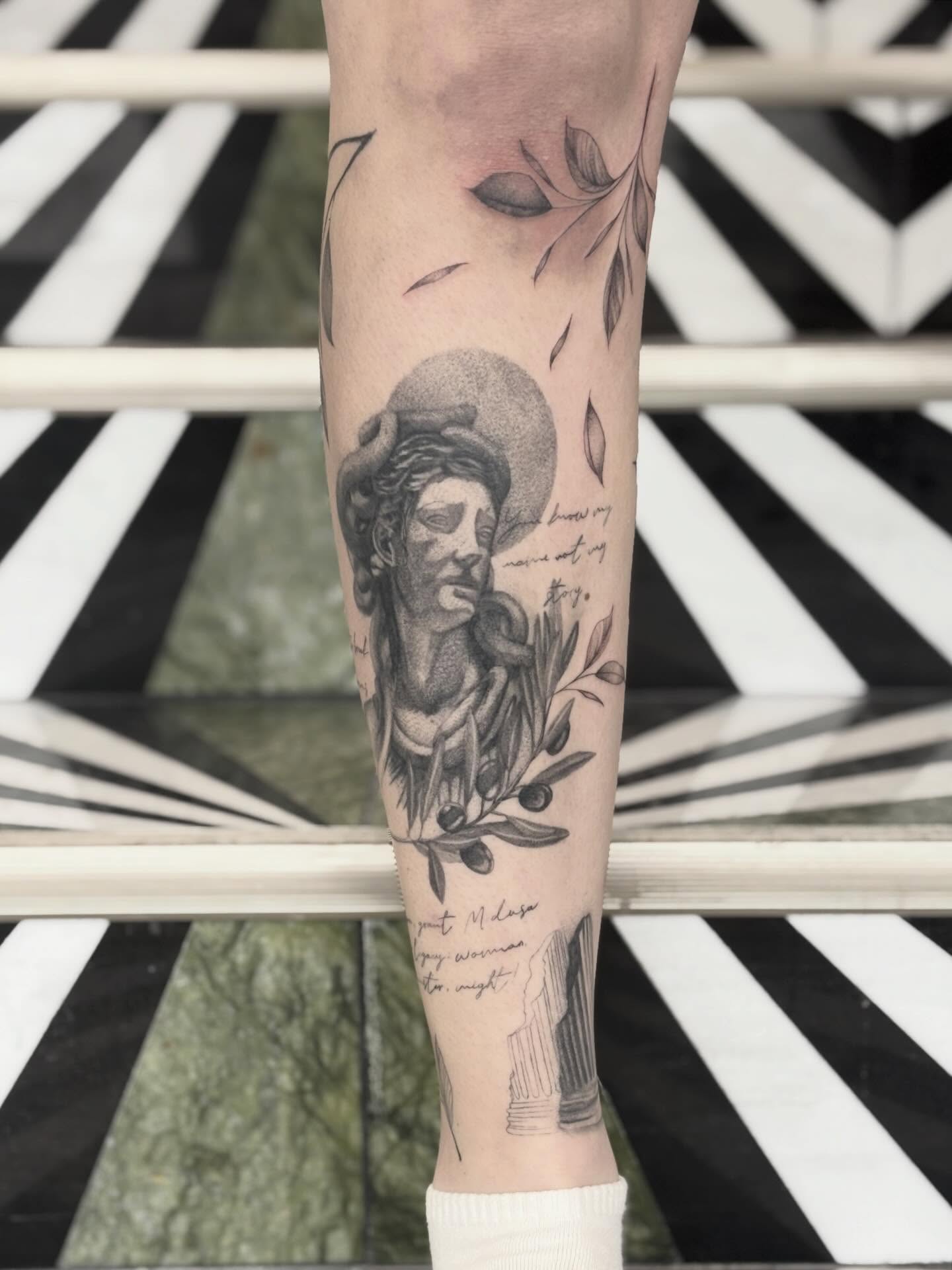 Statue head realism tattoo on the forearm by Jazzlyn Hous