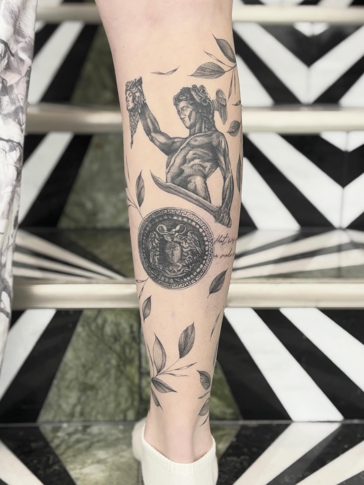Statue with shield black and grey tattoo on the forearm by Jazzlyn Hous