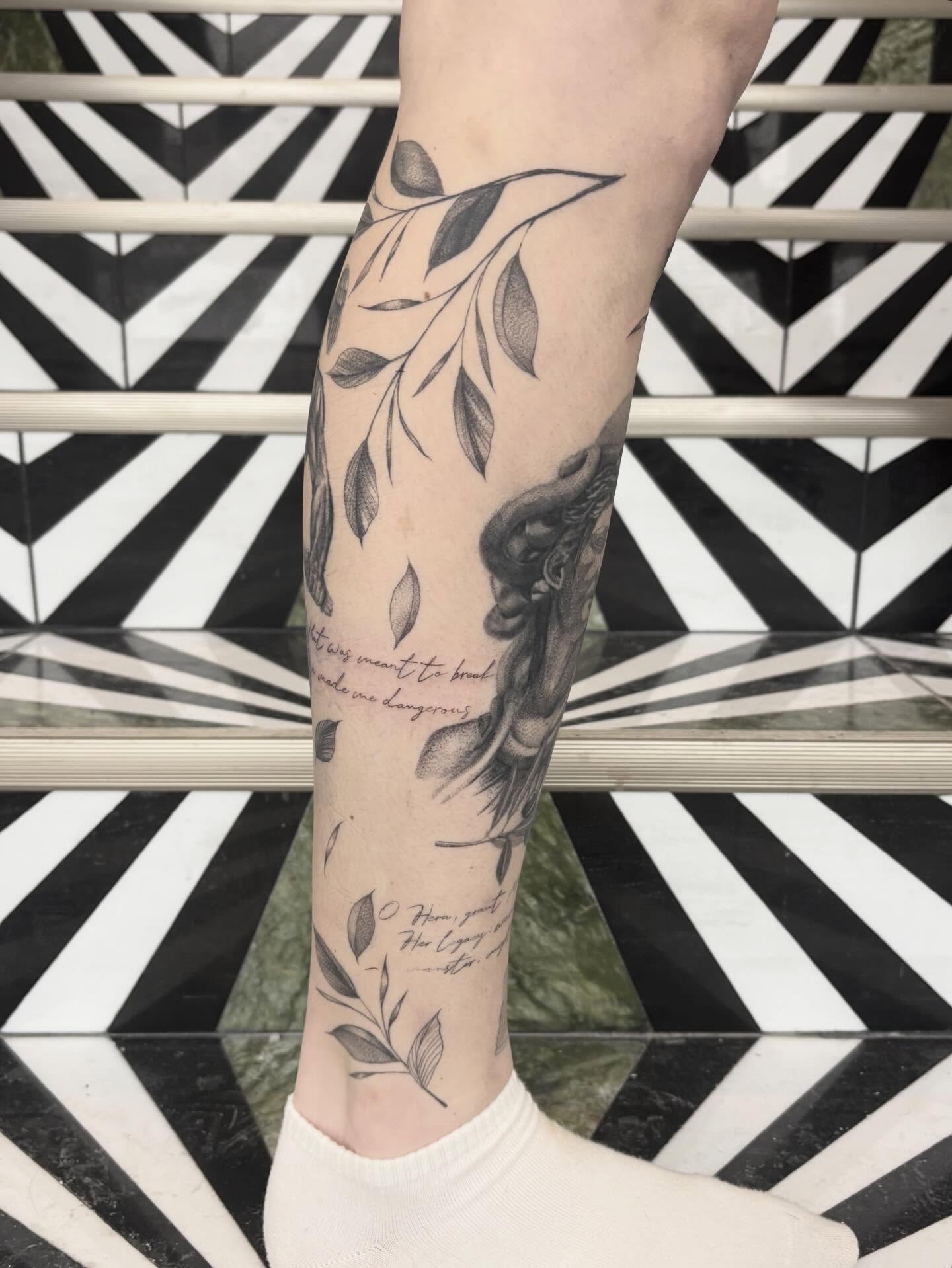 Snake and leaves black and grey tattoo on the forearm by Jazzlyn Hous