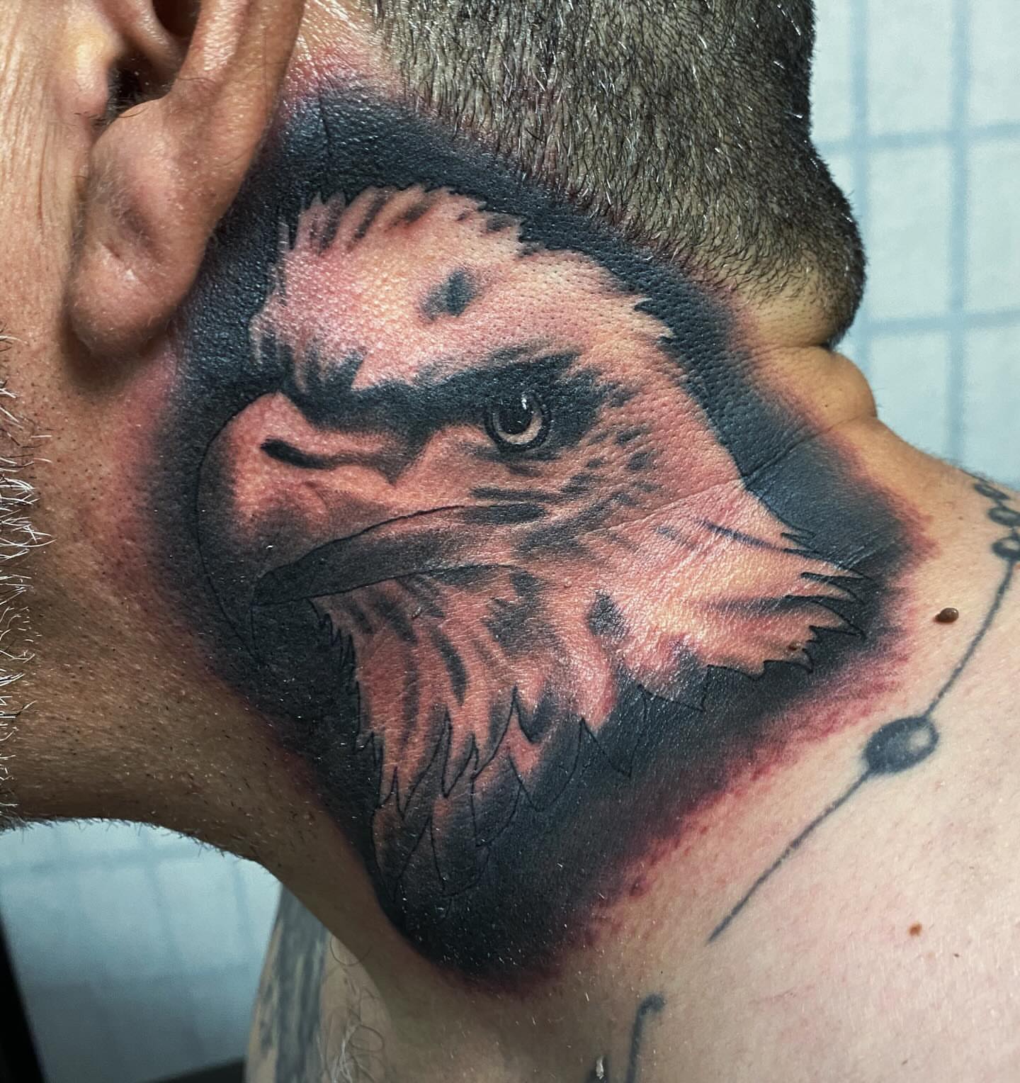 Eagle realism tattoo on the neck by Houston tattoo artist