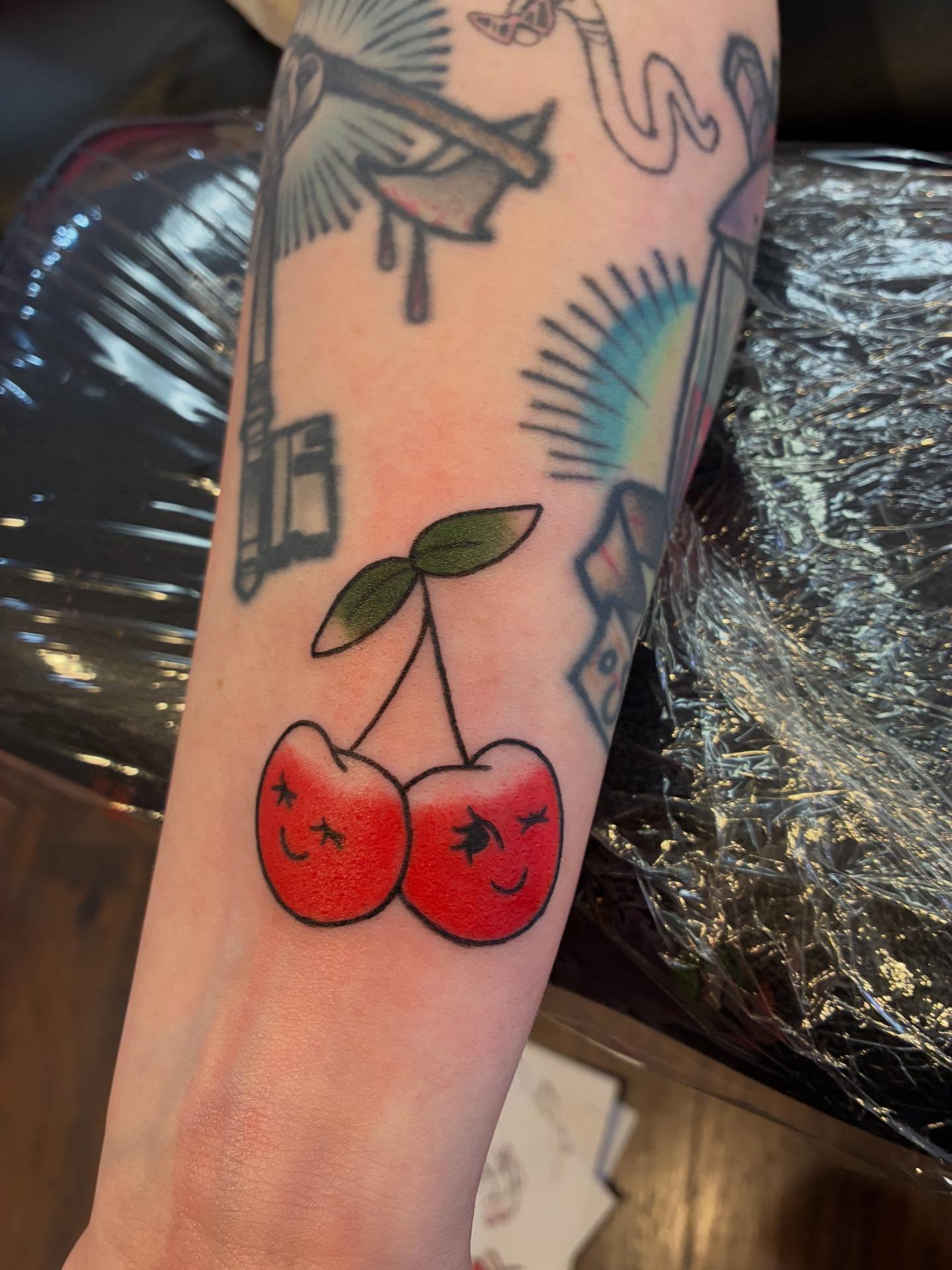 Cherry pair American traditional tattoo on the forearm by ๐๐ช๐๐ซ๐ก๐ ๐๐ฏ๐ถ๐ฉ๐