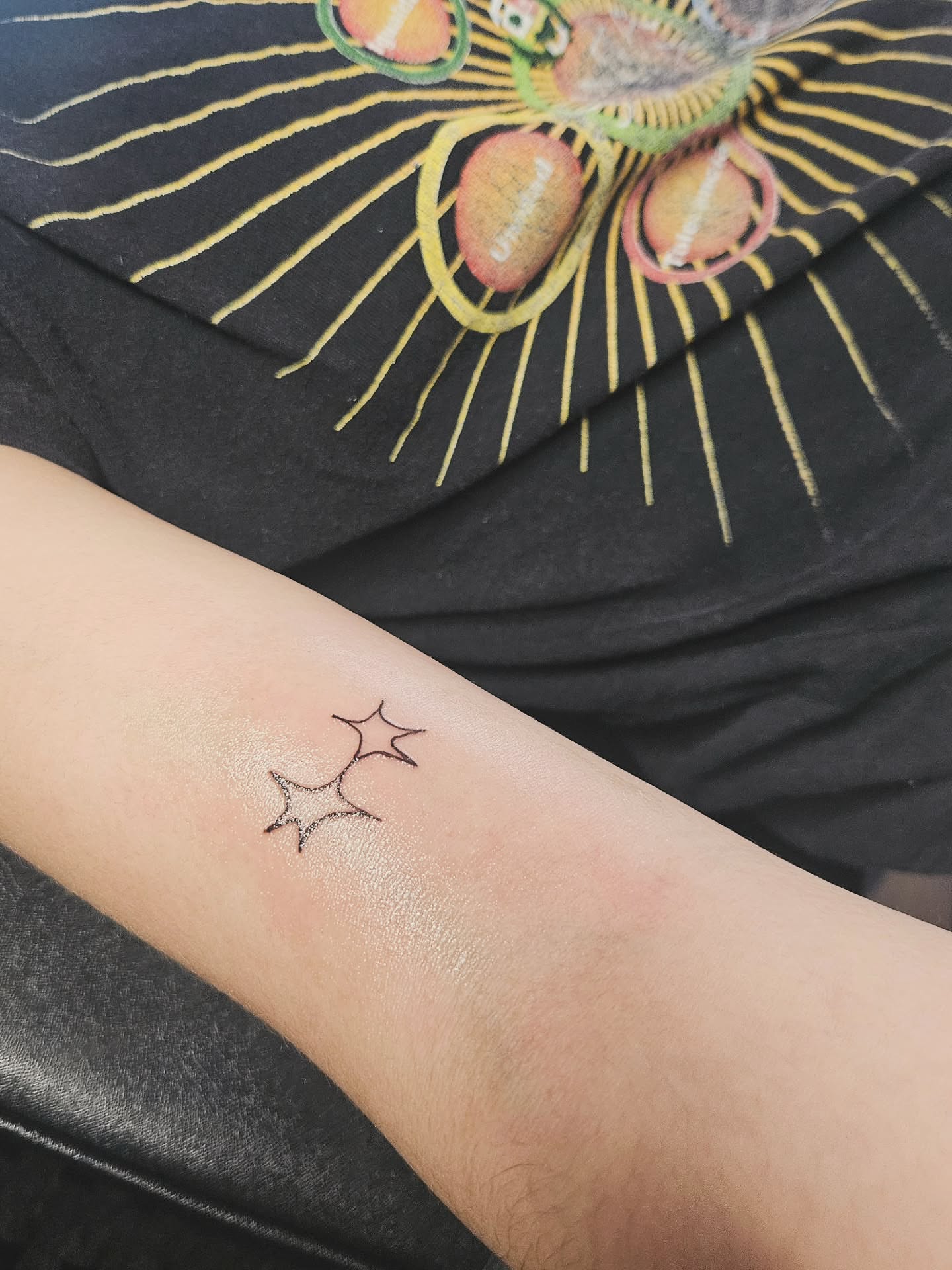 Star minimalist tattoo on the forearm by Ammy