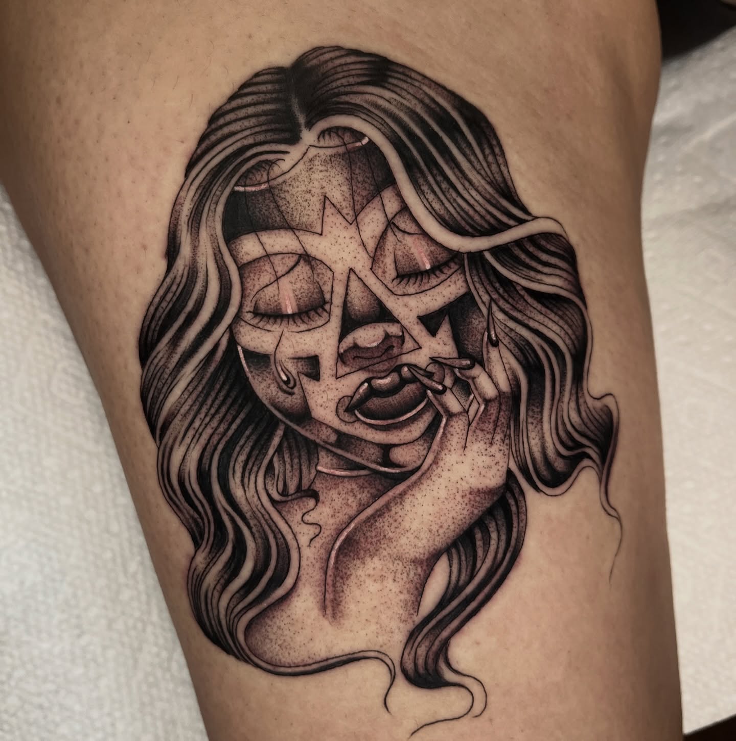 Woman with surreal expression dotwork tattoo on the thigh by Jesus Pieces