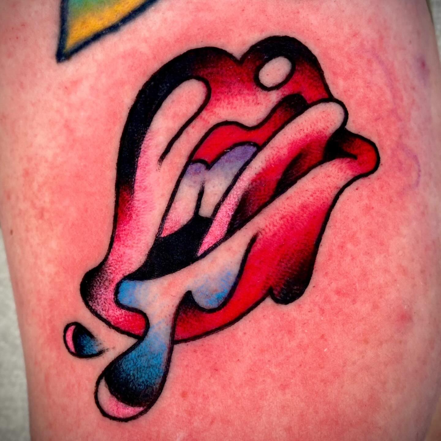 Rolling stones tongue American traditional tattoo on the thigh by Zach Knisley (Wiz)