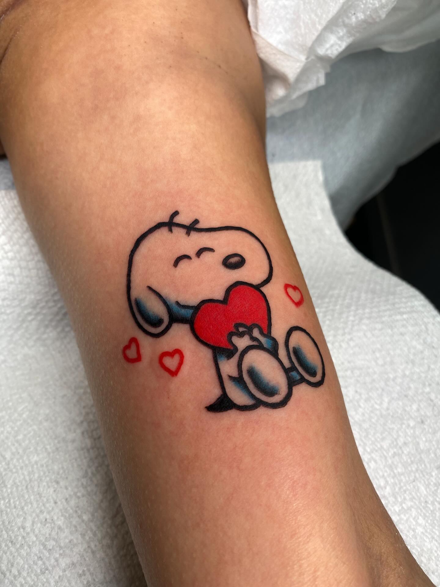Snoopy dotwork tattoo on the forearm by @rubber_band_dan, San Francisco, California