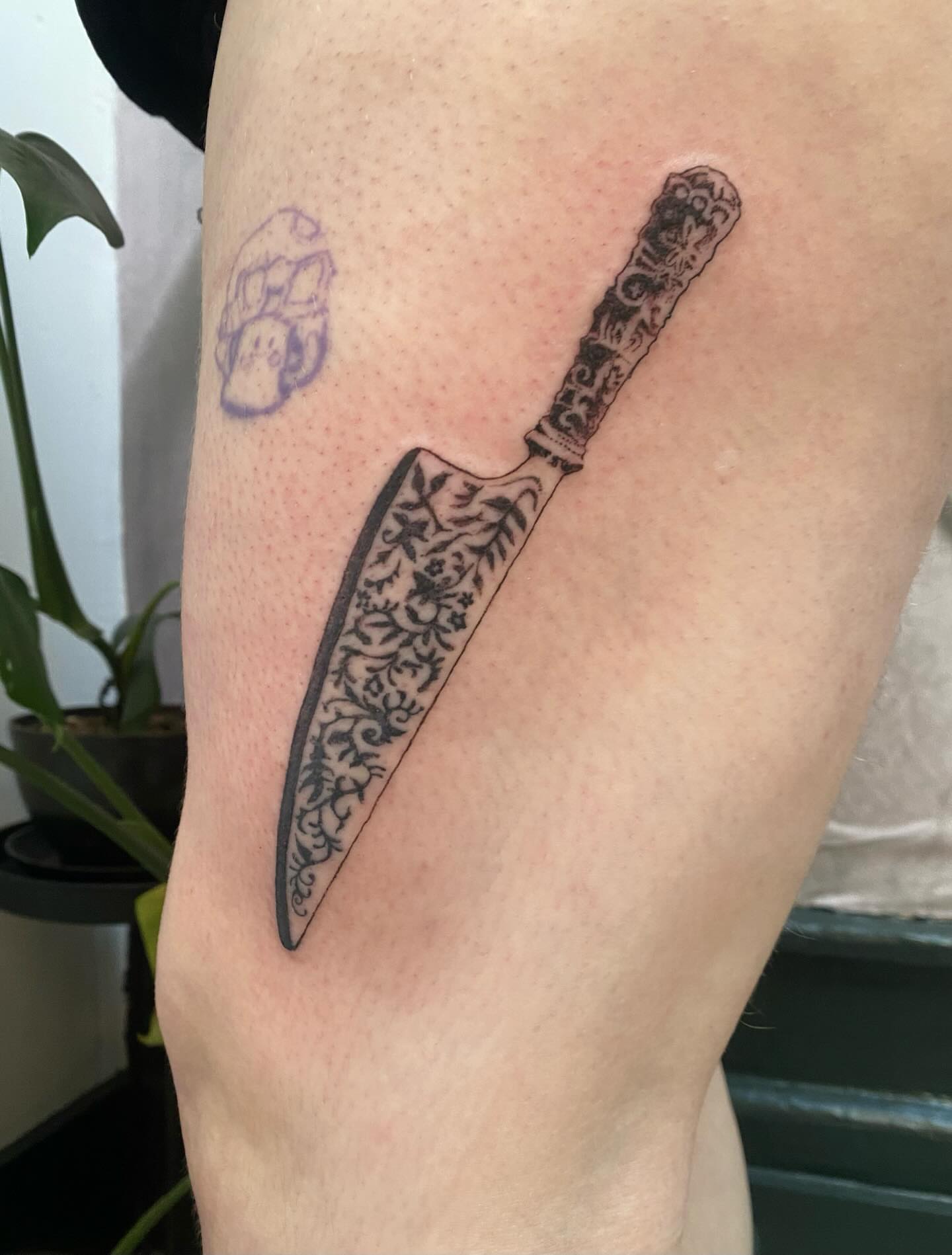 Knife black and grey tattoo on the upper arm by sarah 🗝️