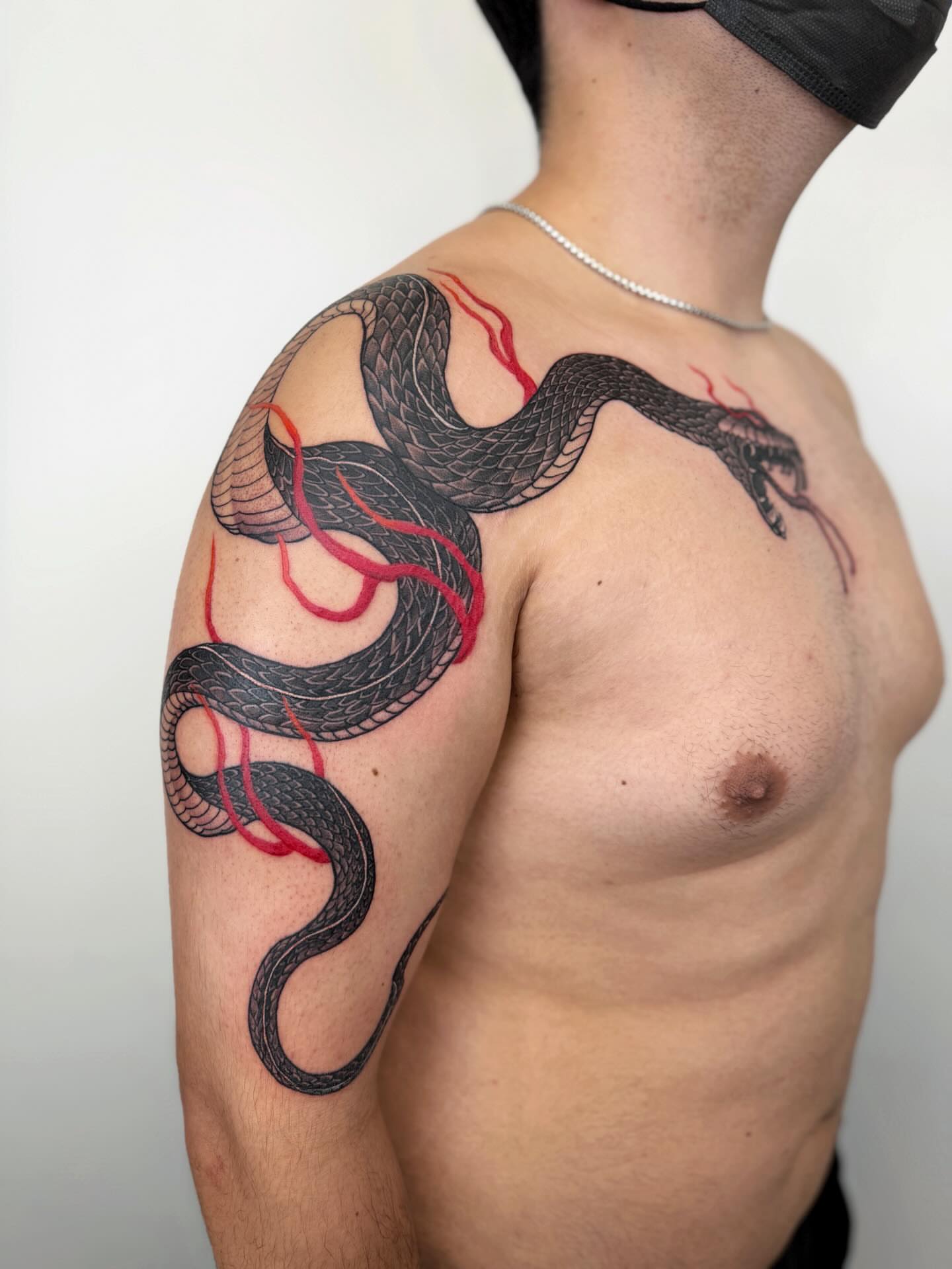 Snake realism tattoo on the shoulder by Jiang_Tattooer