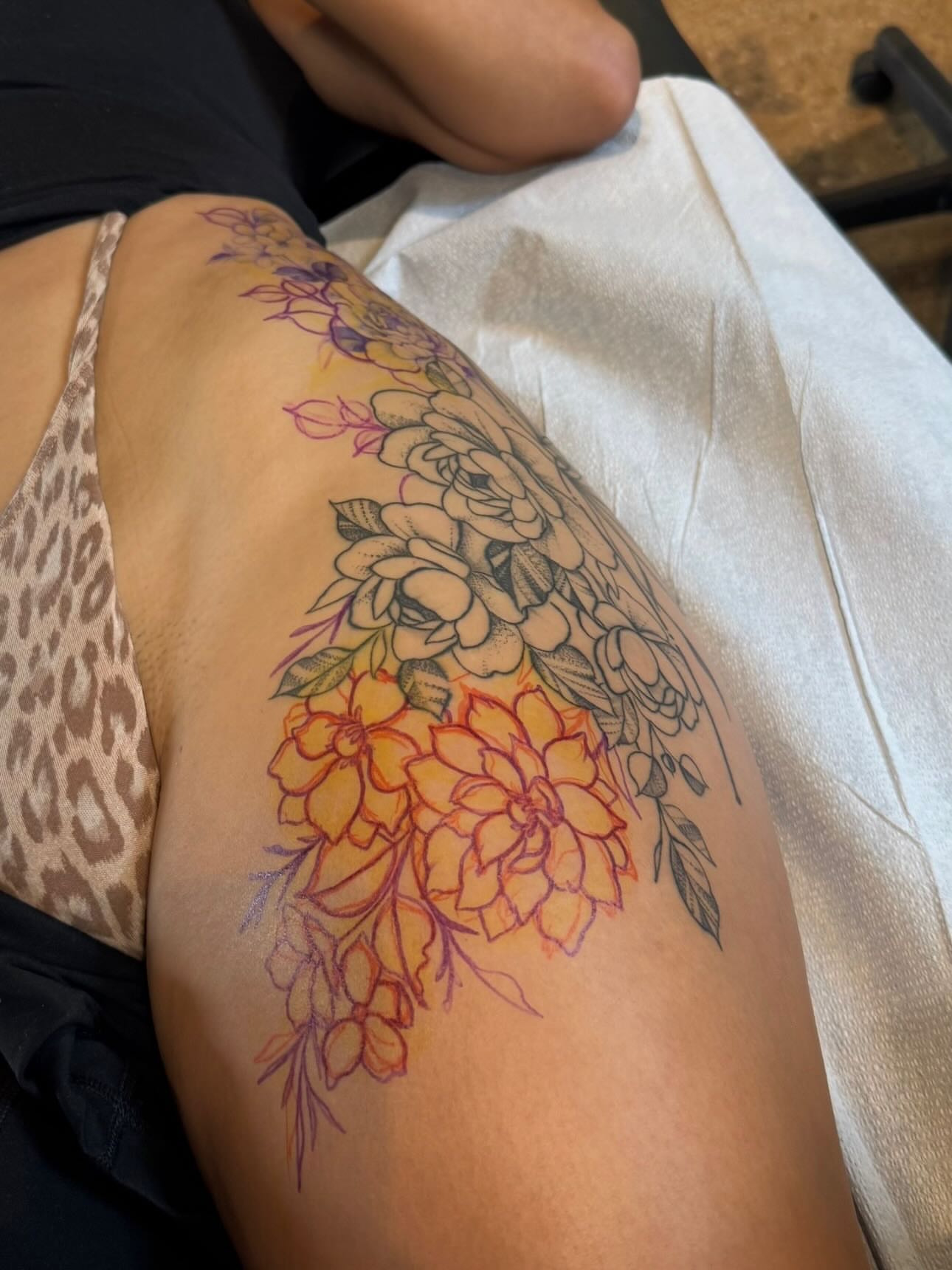 Floral bouquet new school tattoo on the thigh by Gabrielle Mack