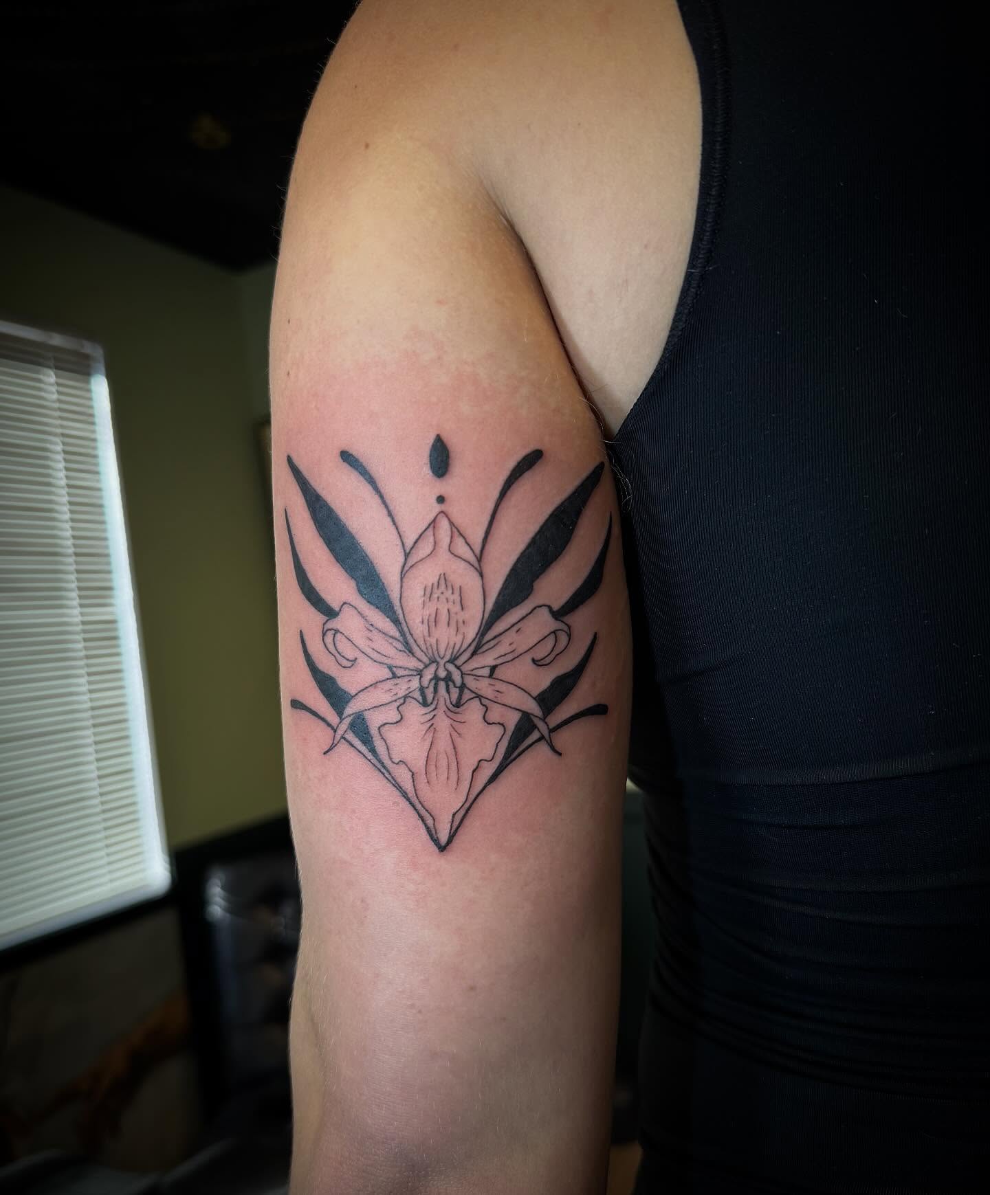 Orchid geometric tattoo on the forearm by Taytum Marsing, Salt Lake City, Utah