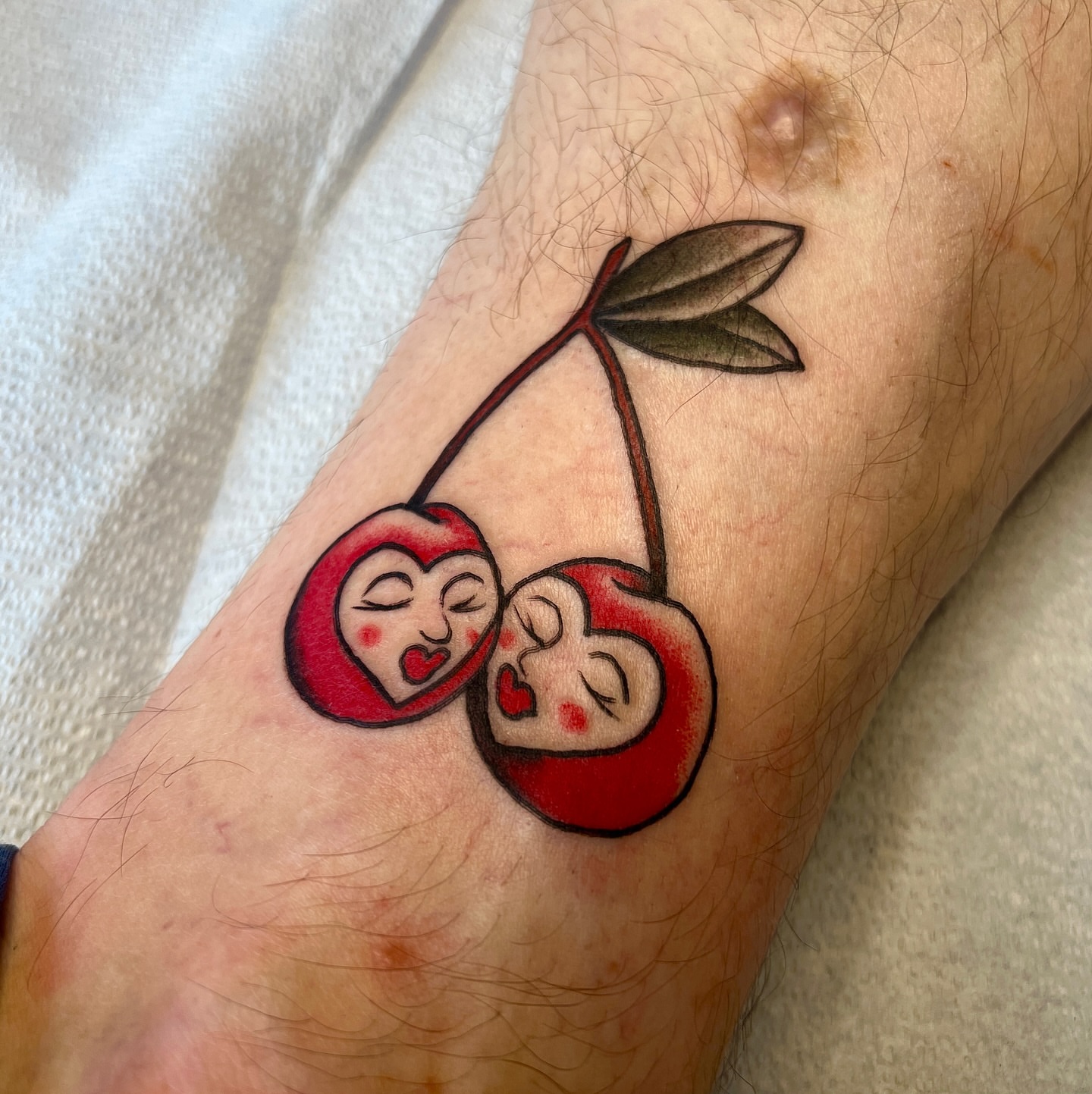 Cherry couple dotwork tattoo on the forearm by David Delacruz