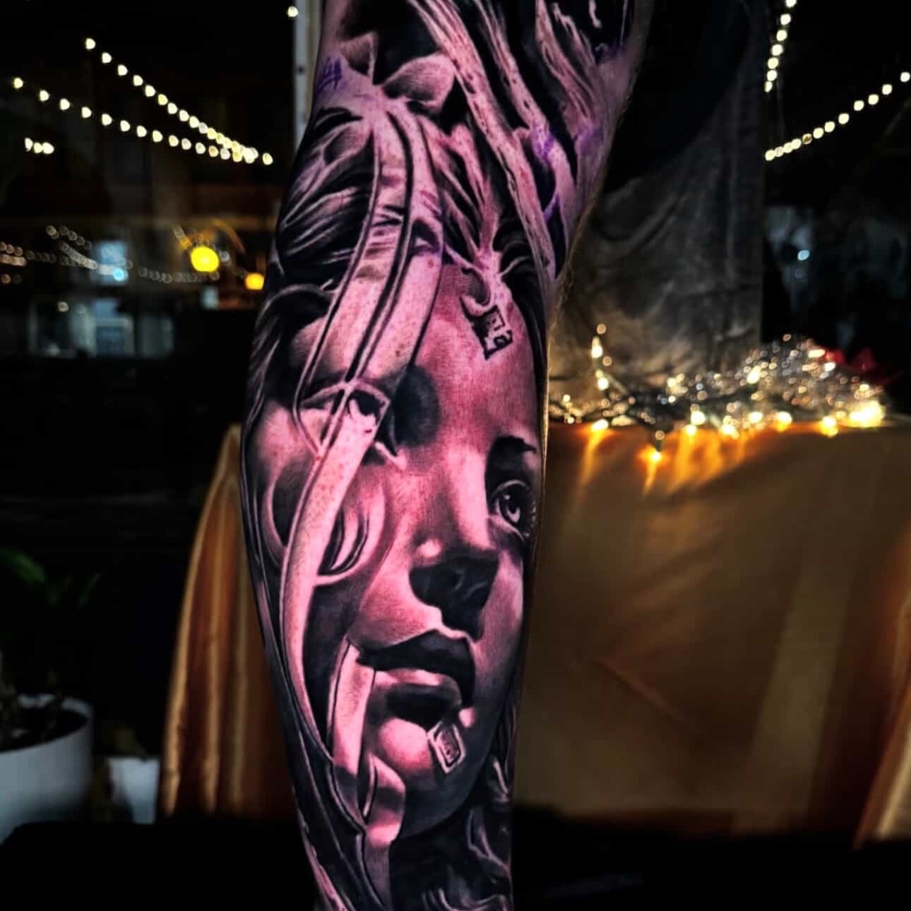 Portrait realism tattoo on the forearm by Donald Reynolds
