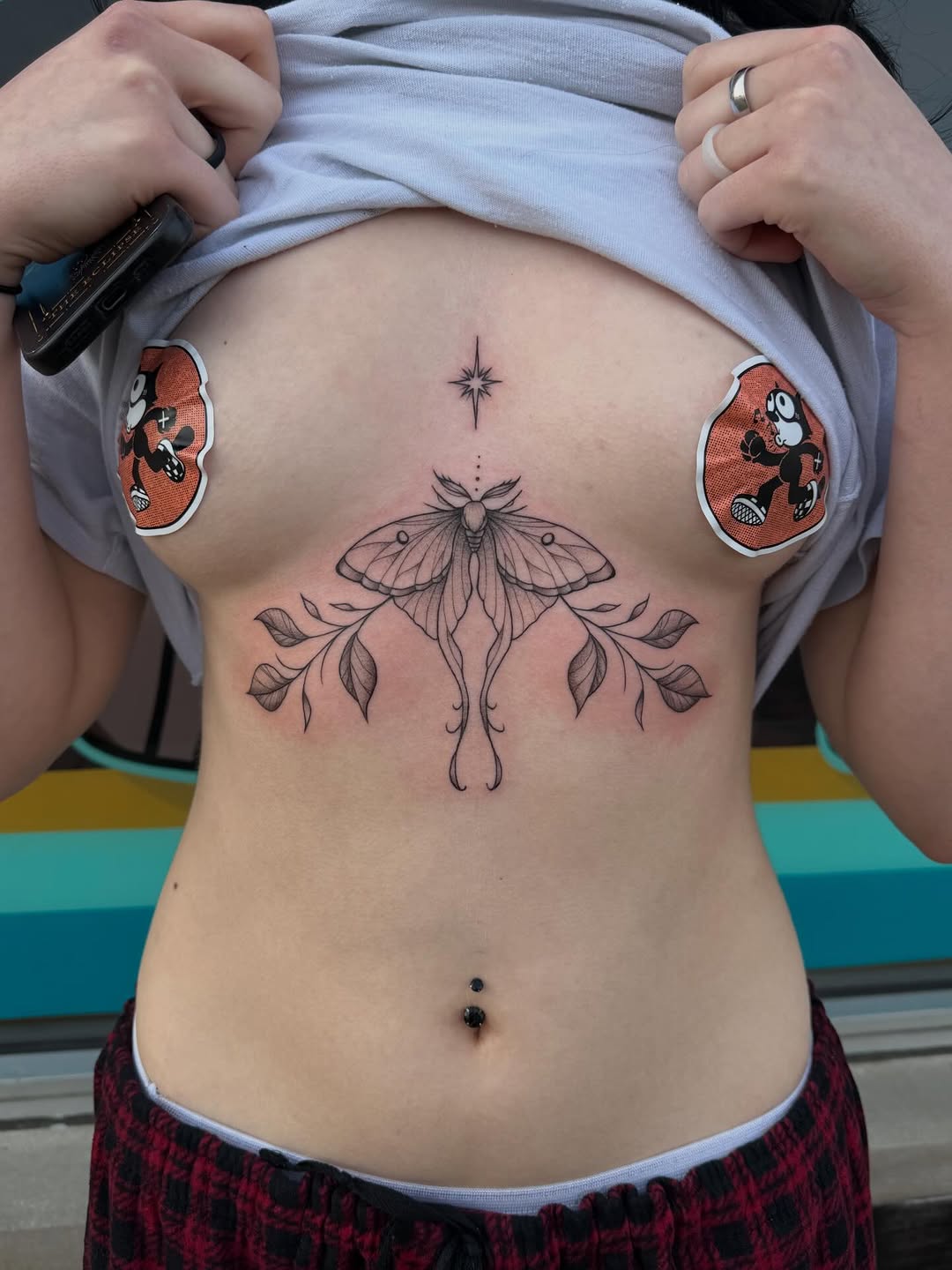 Moth with leaves cyber sigilism tattoo on the torso by 𝕯𝖆𝖓𝖎