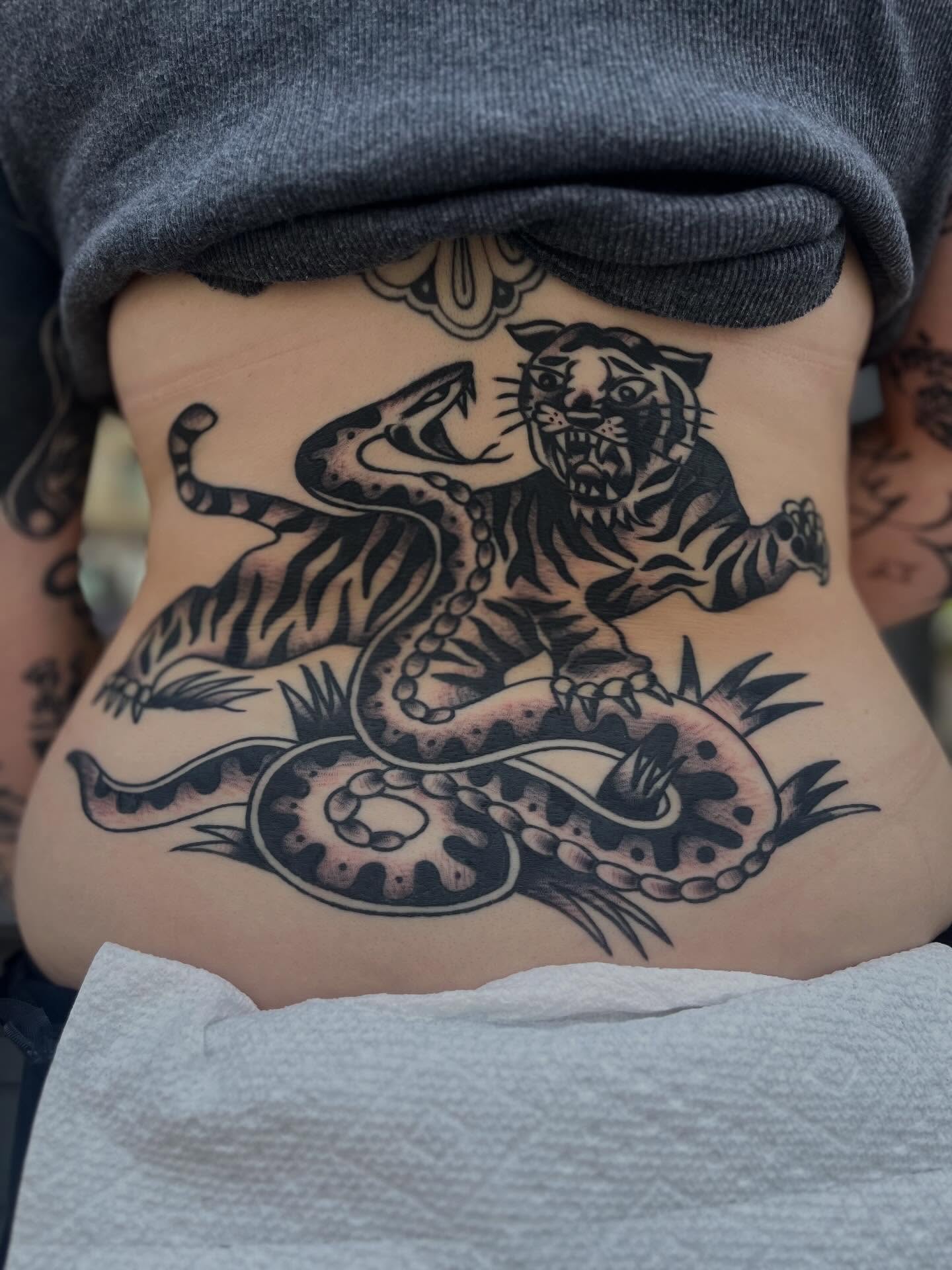 Tiger and snake American traditional tattoo on the torso by zach arlan, Kansas City, Missouri