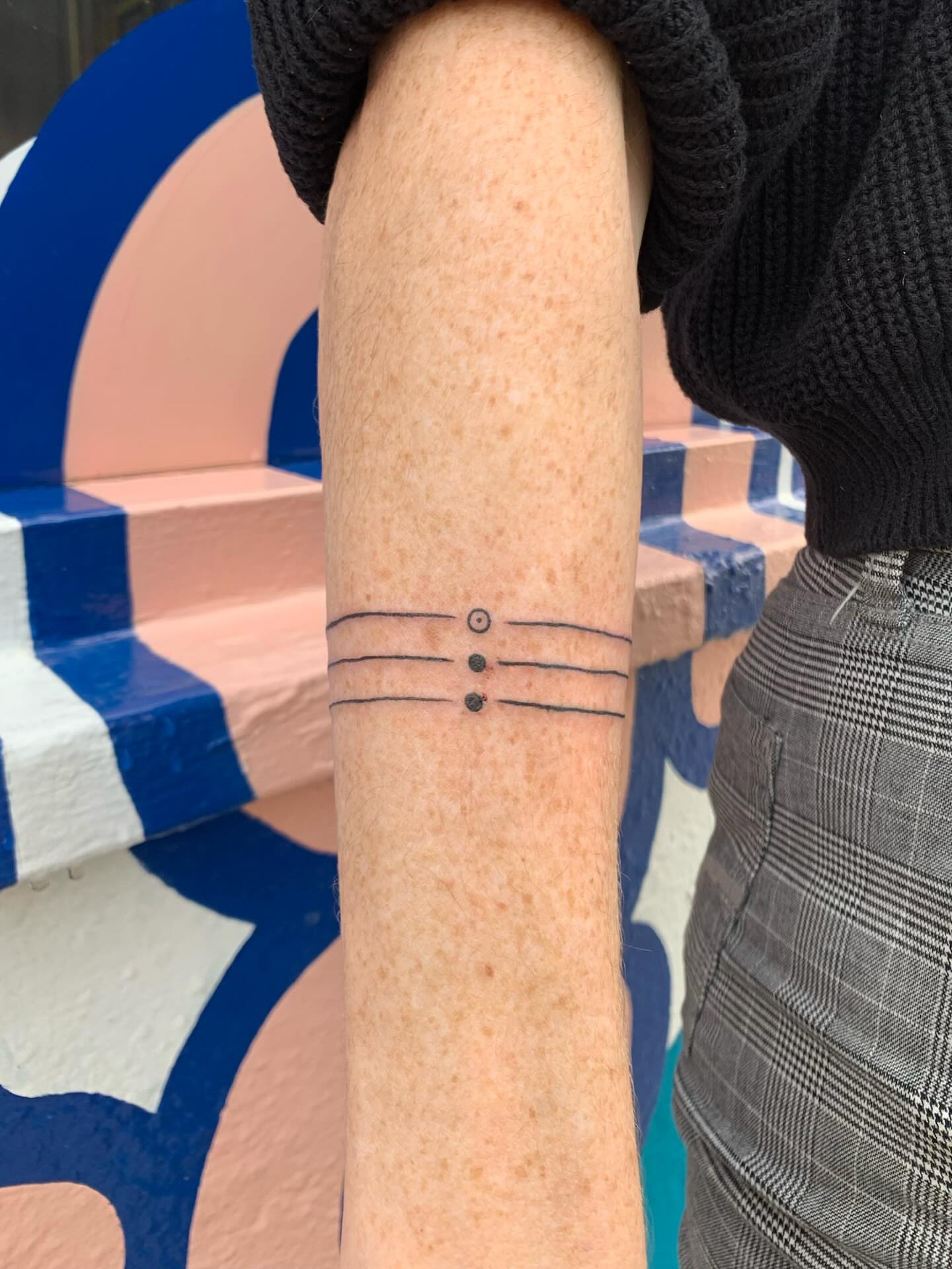 Horizontal lines with dots dotwork tattoo on the forearm by CharlieBoy