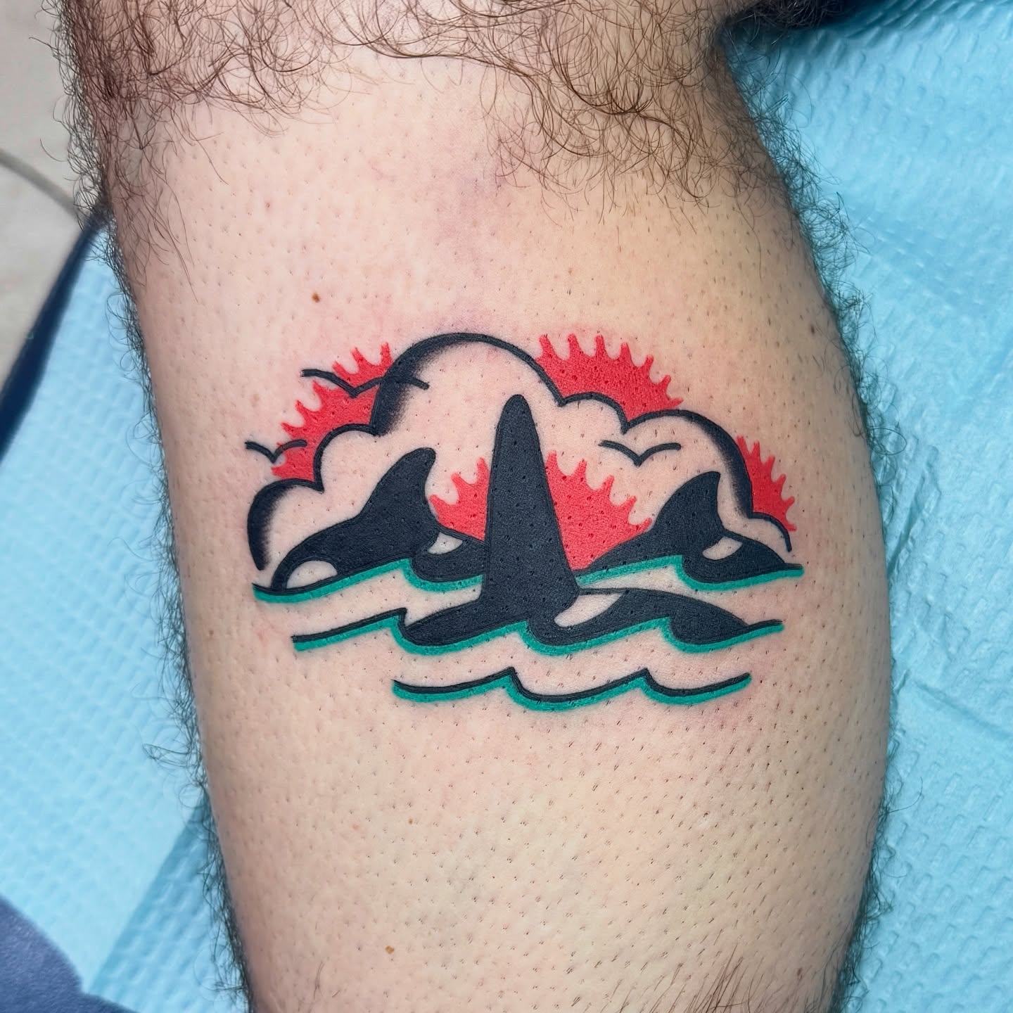 Whales and sun geometric tattoo on the thigh by Sam