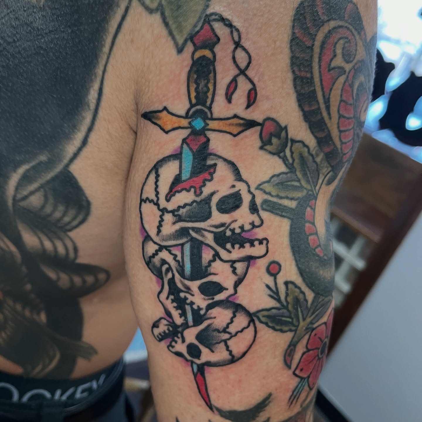 Skulls and dagger American traditional tattoo on the forearm by You’ll save me in your phone as Tattoo Tim