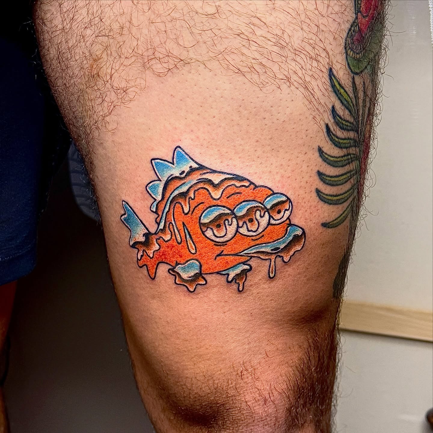 Melted fish new school tattoo on the thigh by Derek Cilla, Bethlehem, Pennsylvania