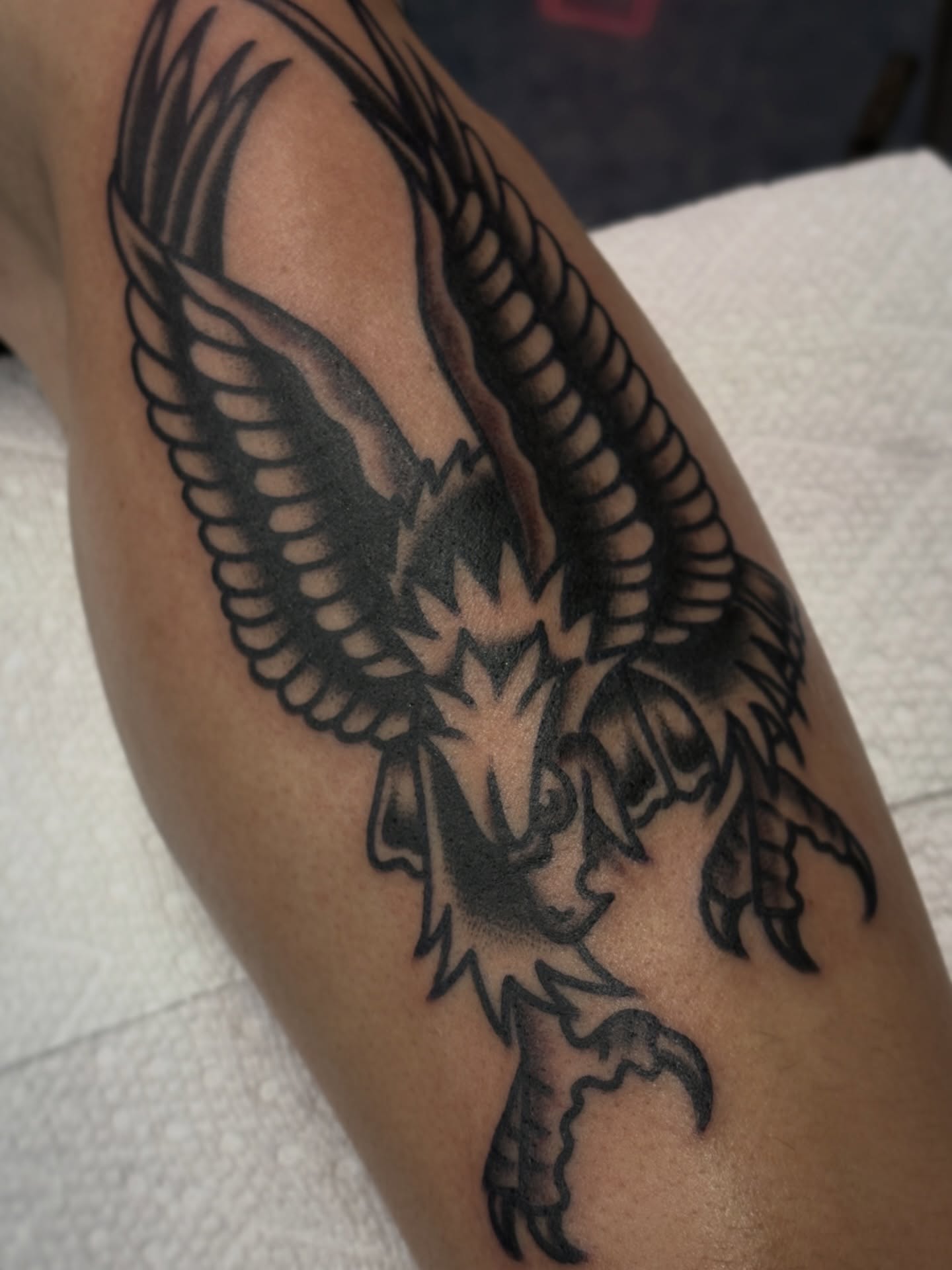 Eagle black and grey tattoo on the thigh by Carlos Gonzalez Tattoo, Dallas, Texas